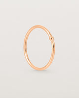 Standing view of the Suspend Ring in Rose Gold.
