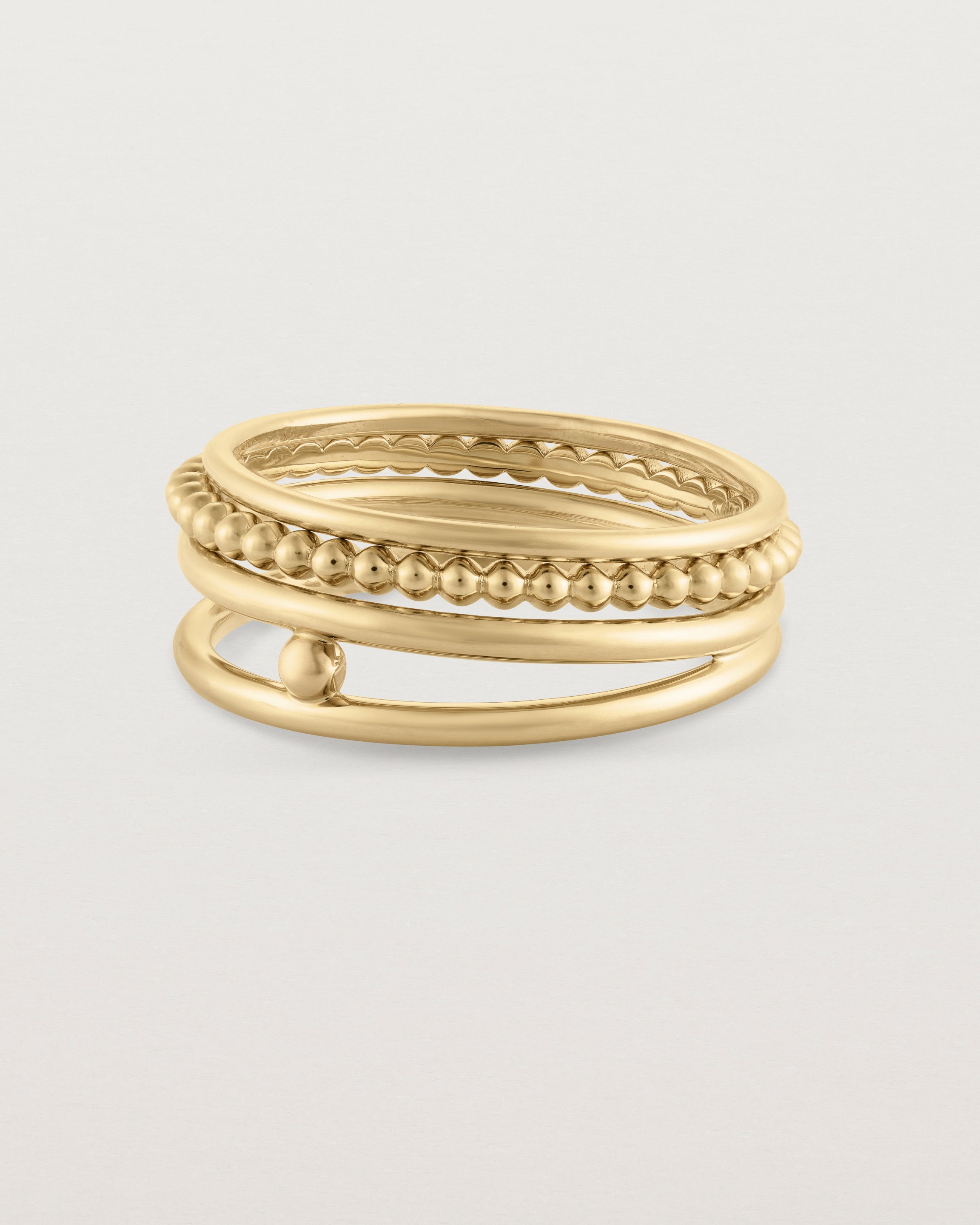 Angled view of the Textured Curated Ring Set in yellow gold.