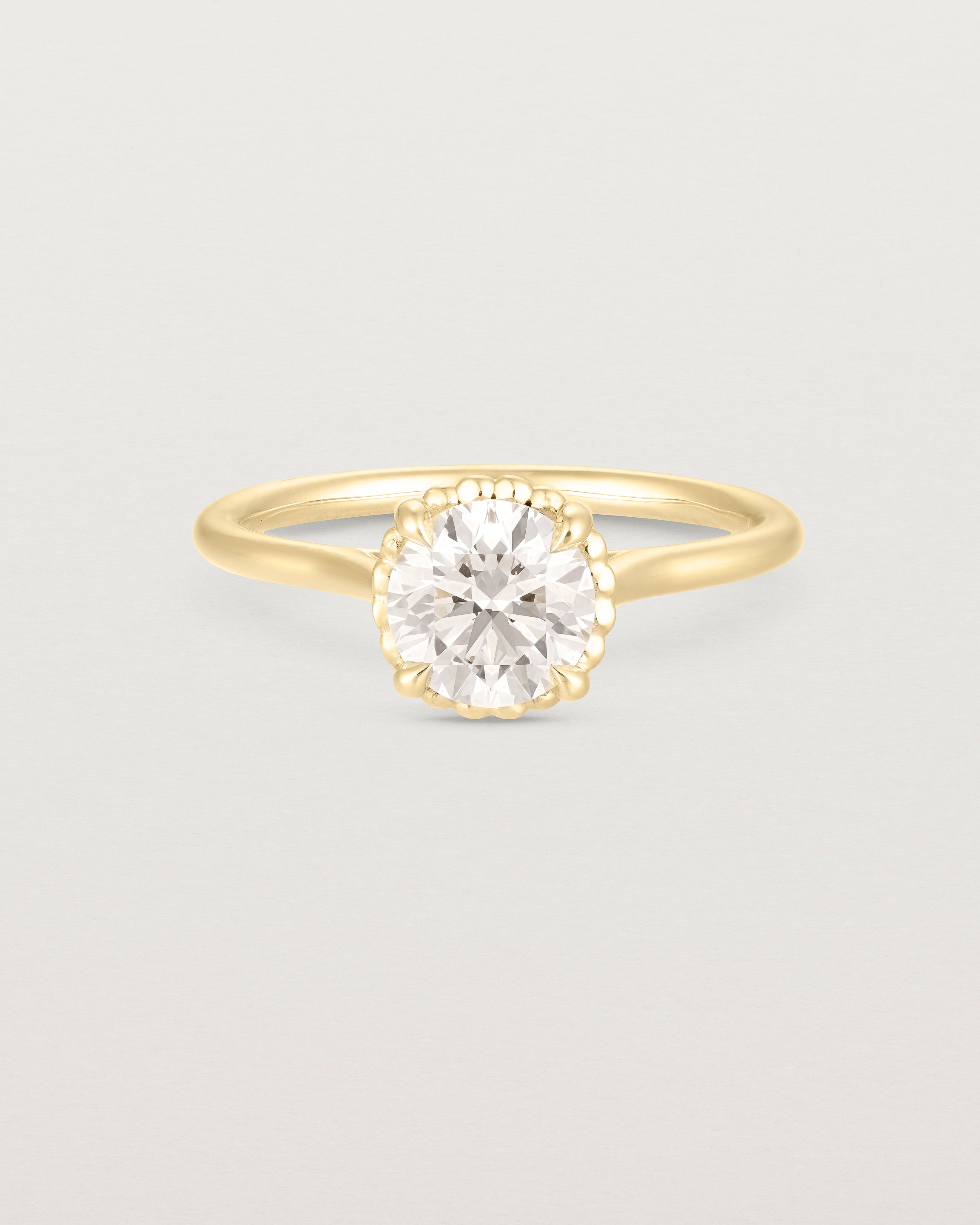 A front view of the Thea Round Solitaire with a white Laboratory Grown Diamond in Yellow Gold