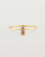 Fine yellow gold band featuring a marquise cut brown rutilated quartz stone