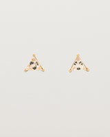 A pair of yellow gold studs featuring a triangle shaped light yellow rutilated quartz