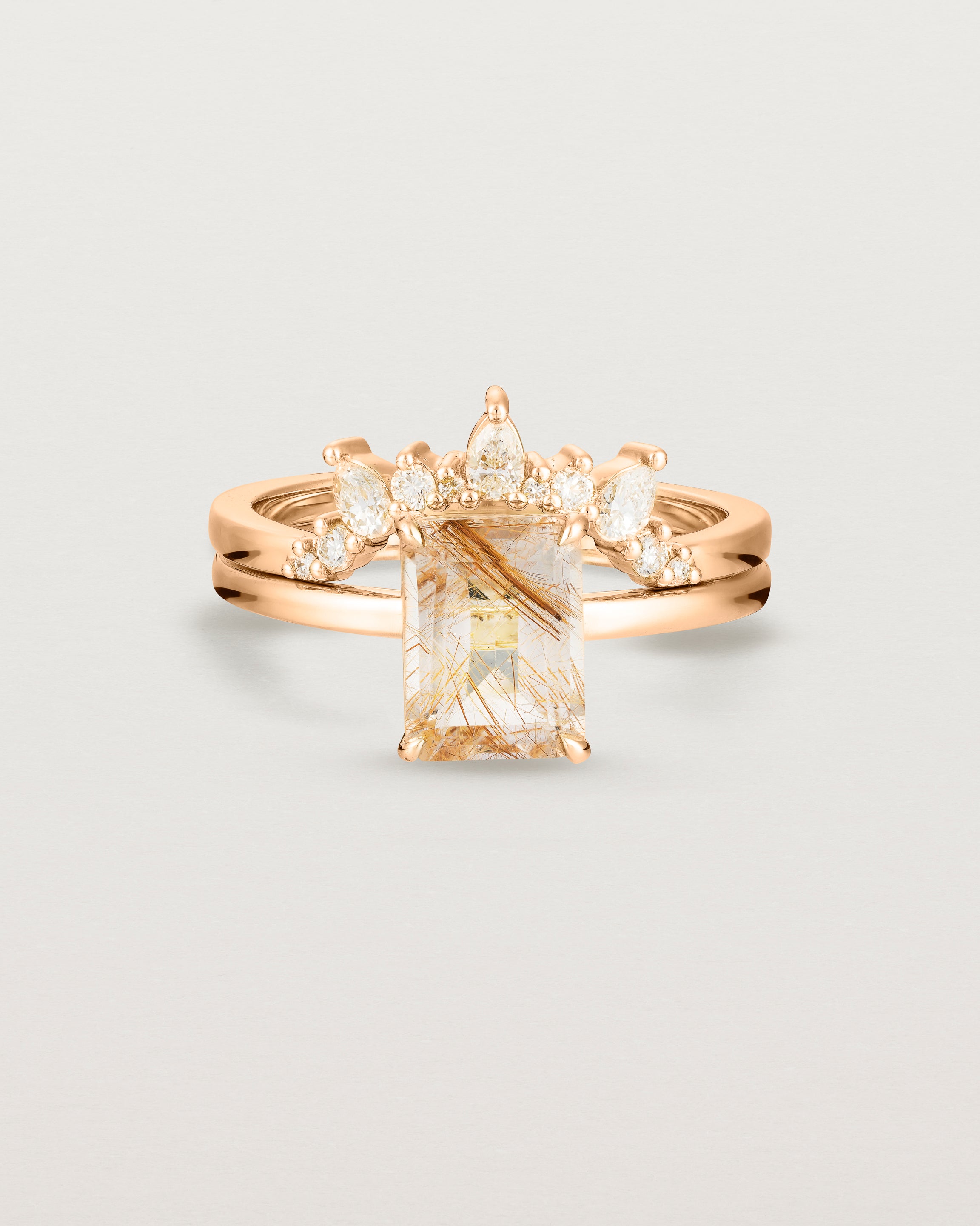 Front view of the Una Emerald Solitaire | Rutilated Quartz | Rose Gold stacked with the Odette Crown Ring | Diamonds.