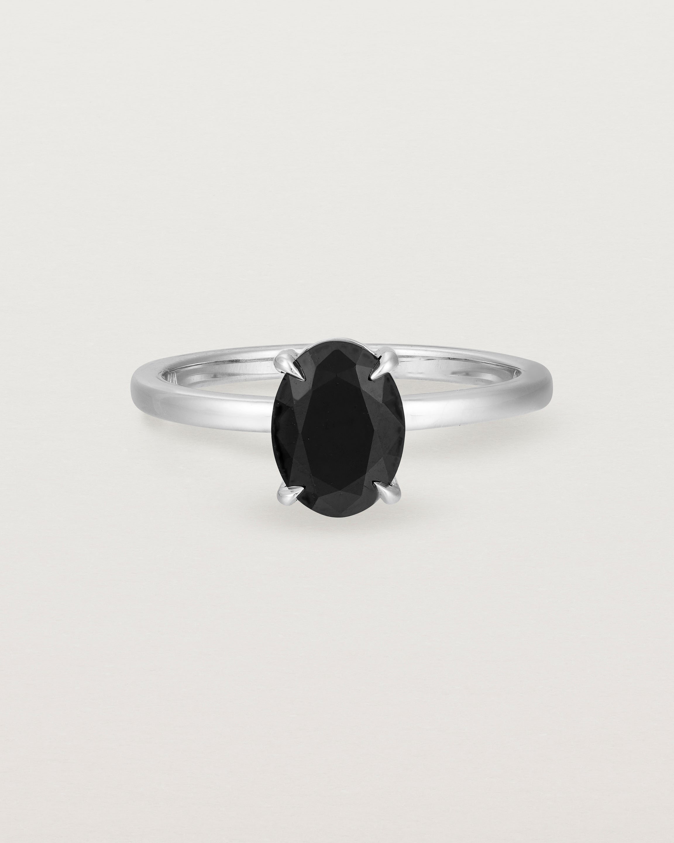 Front view of the Una Oval Solitaire | Black Spinel | White Gold.