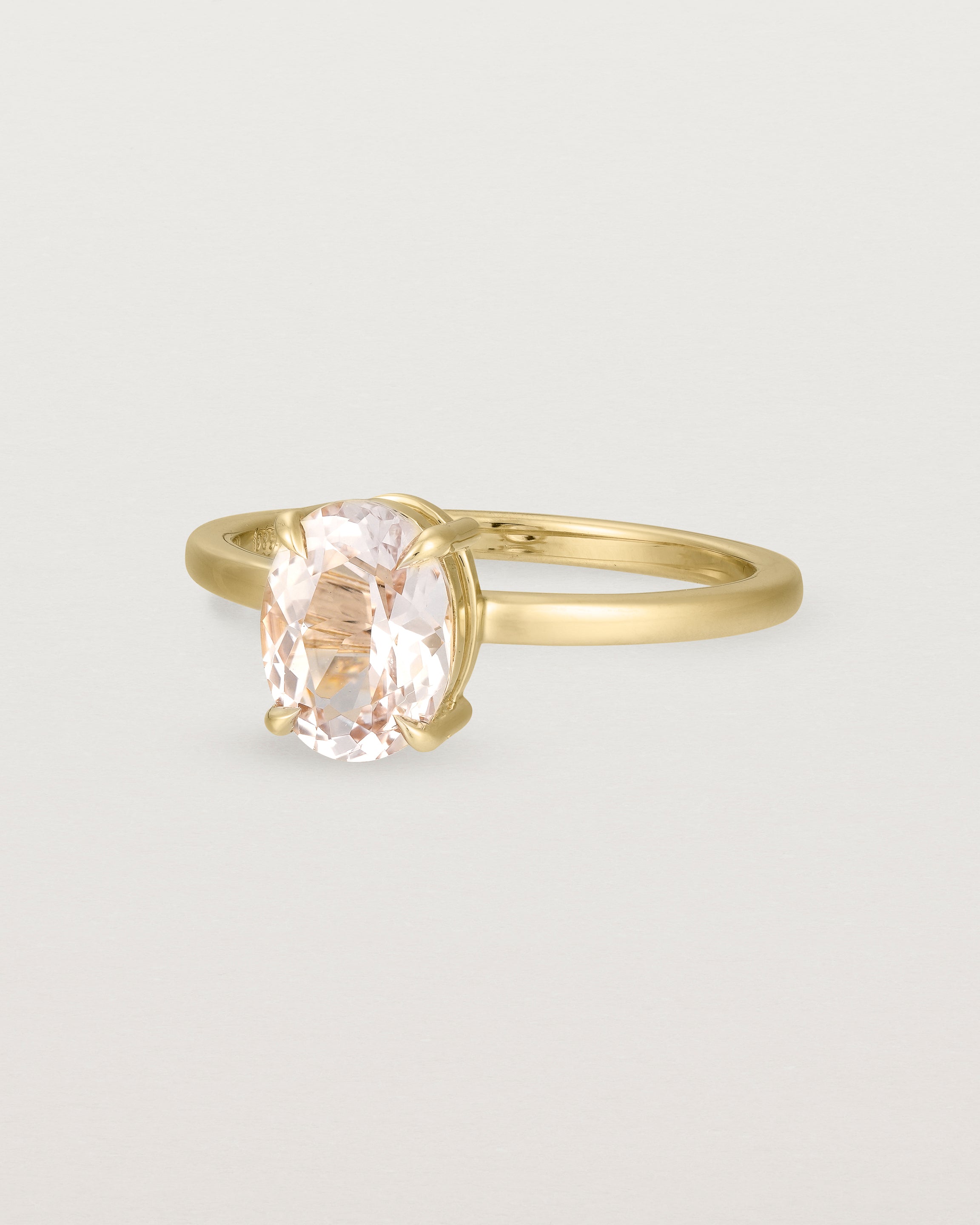 Angled view of the Una Oval Solitaire | Morganite | Yellow Gold.