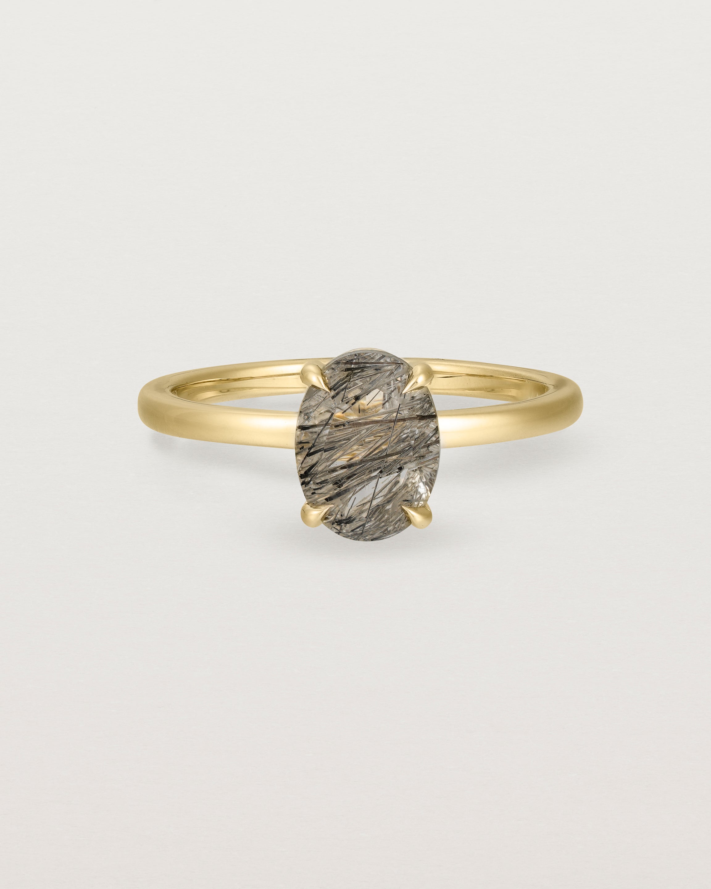 Front view of the Una Oval Solitaire | Tourmalinated Quartz | Yellow Gold.