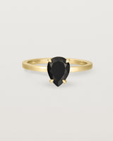 Front view of the Una Pear Solitaire | Black Spinel | Yellow Gold.