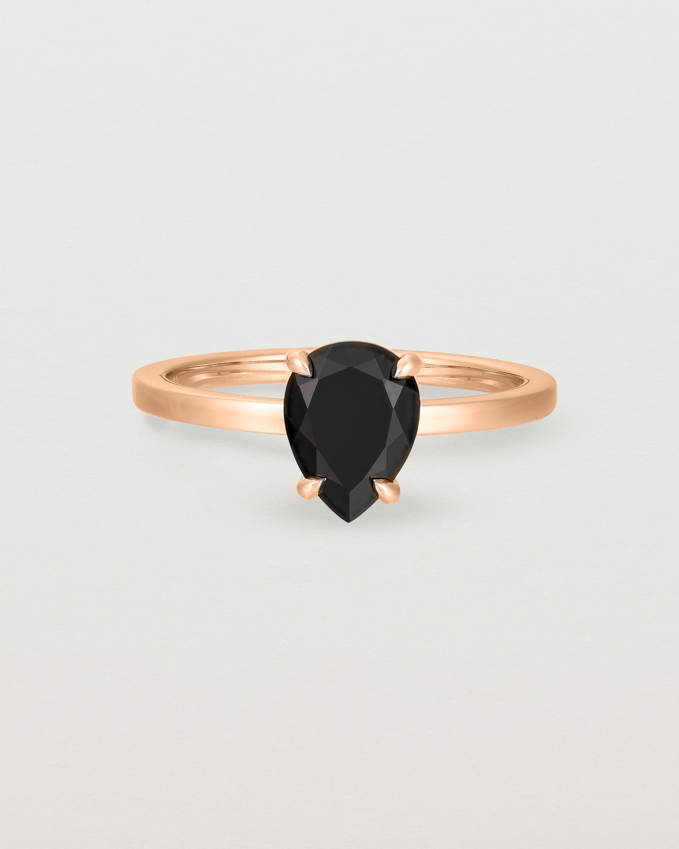 Front view of the Una Pear Solitaire | Black Spinel | Rose Gold.