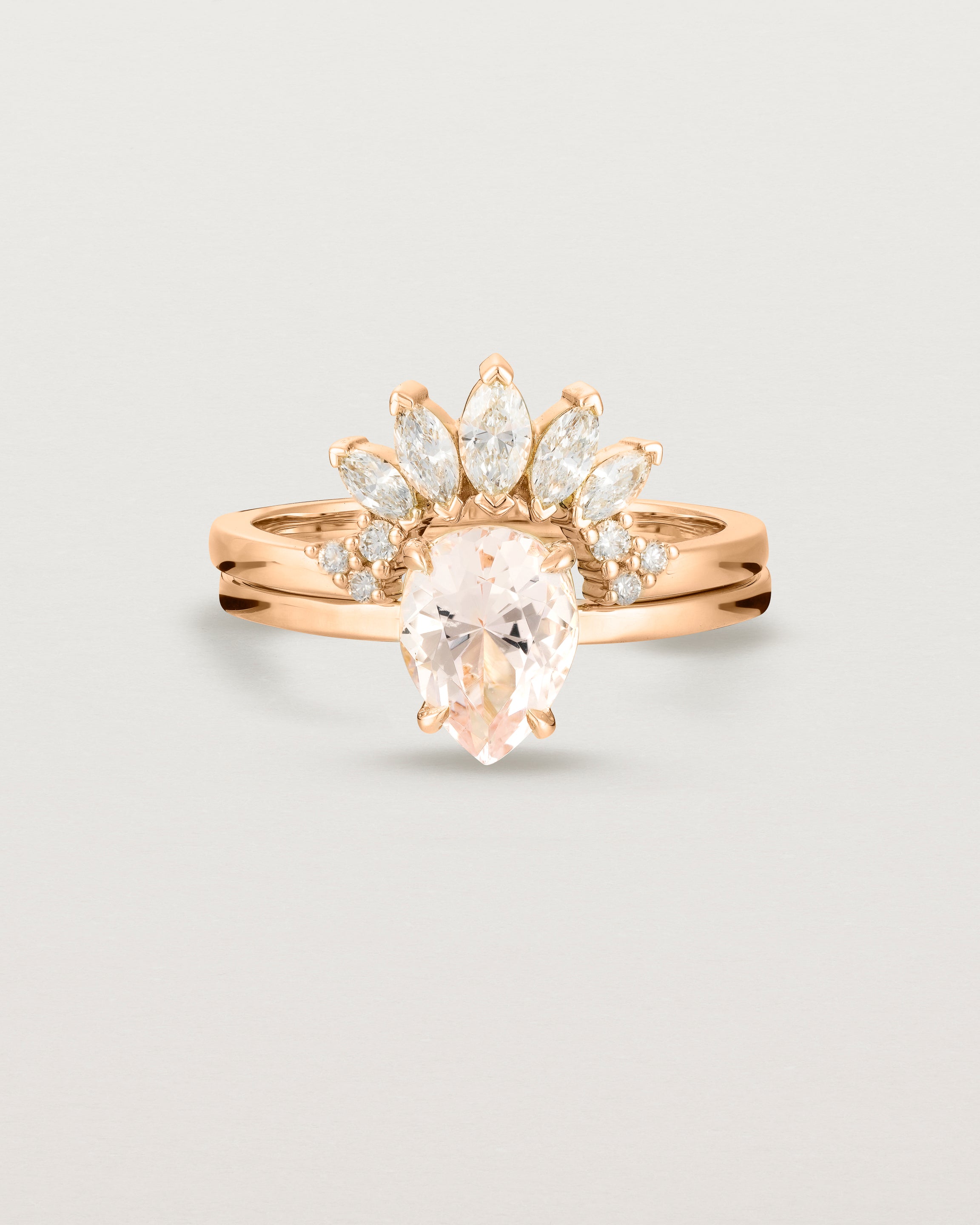 Front view of the Una Pear Solitaire | Morganite | Rose Gold stacked with the Camille Crown Ring | Diamonds.