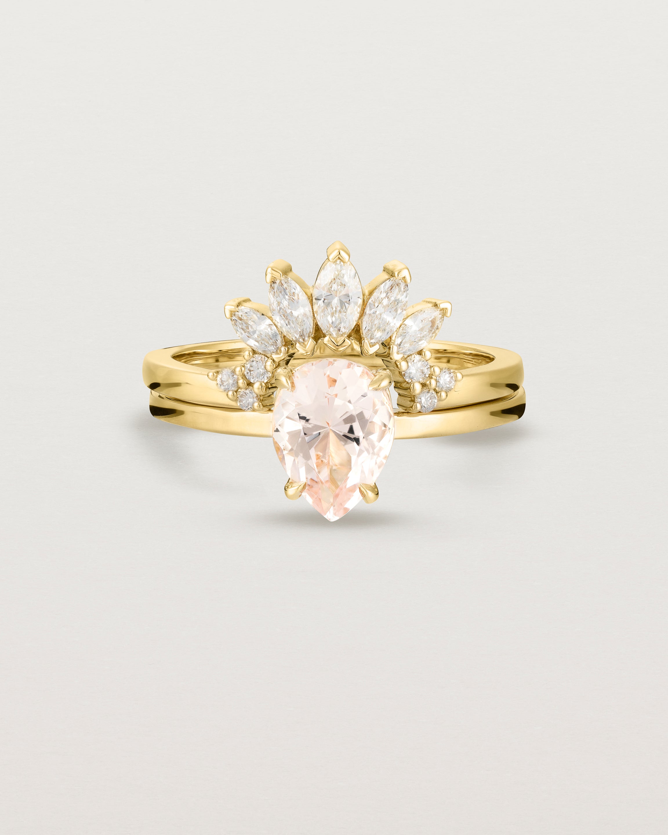 Front view of the Una Pear Solitaire | Morganite | Yellow Gold stacked with the Camille Crown Ring | Diamonds.