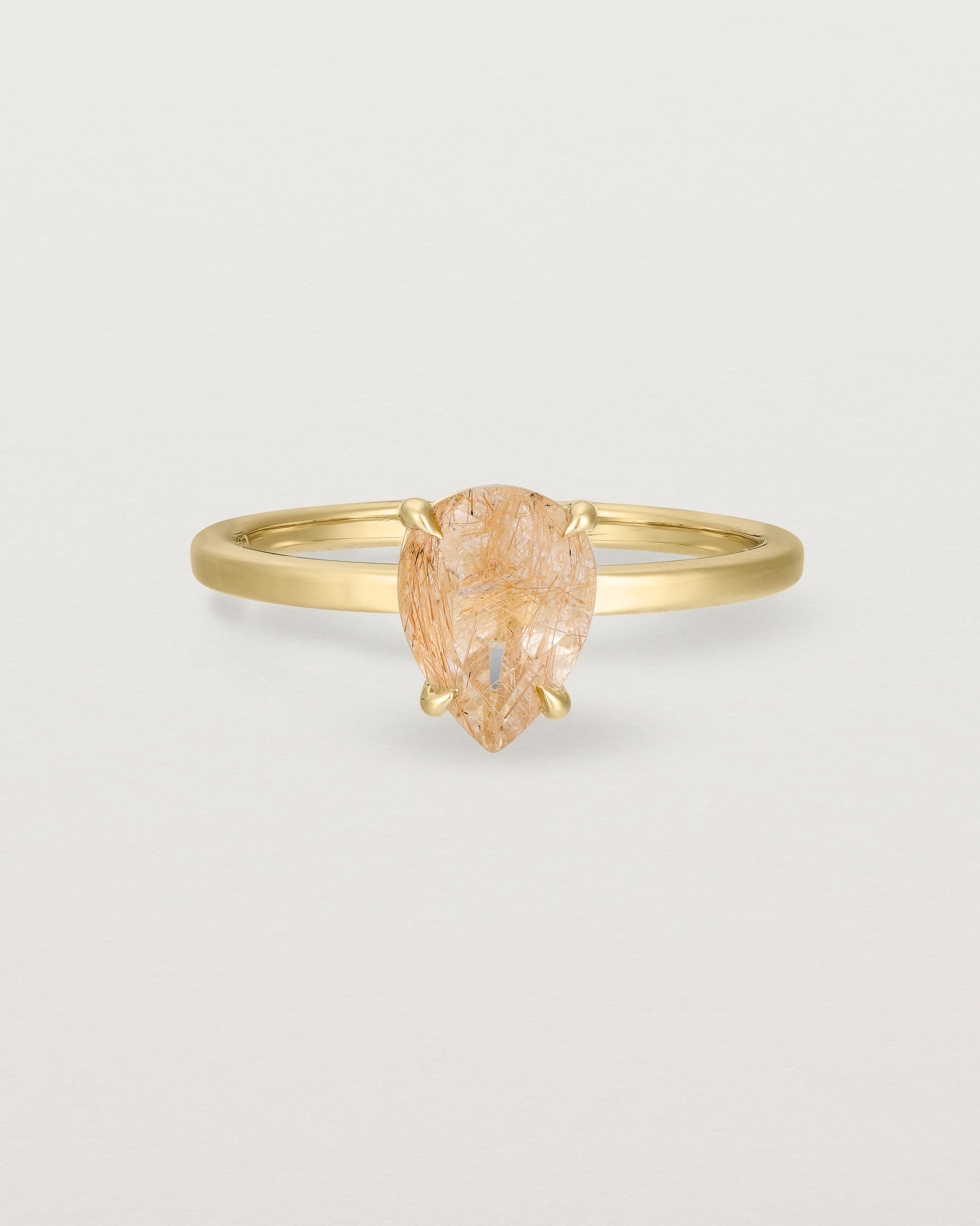 Front view of the Una Pear Solitaire | Rutilated Quartz | Yellow Gold.