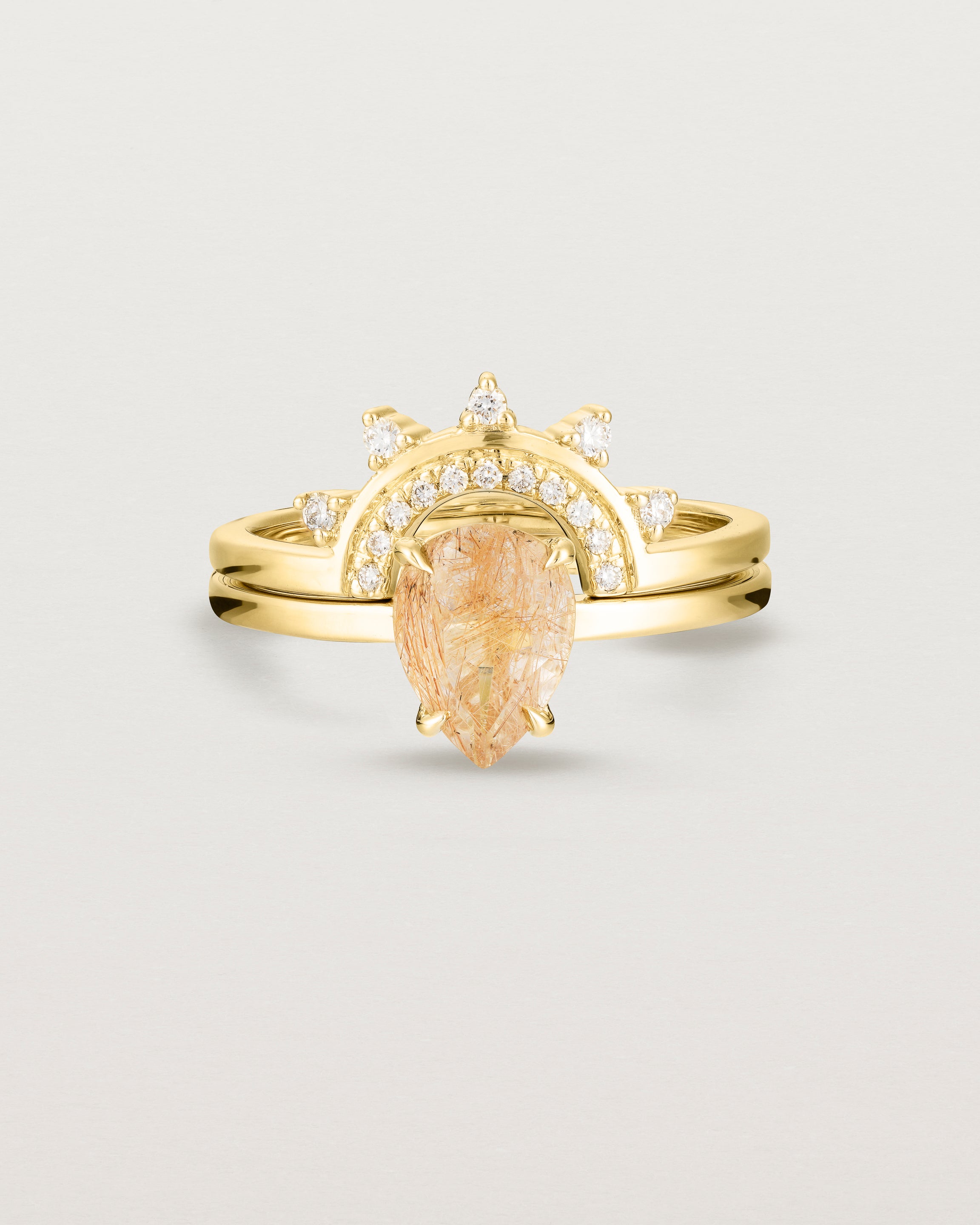Front view of the Una Pear Solitaire | Rutilated Quartz | Yellow Gold stacked with the Adeline Crown Ring | Diamonds. 