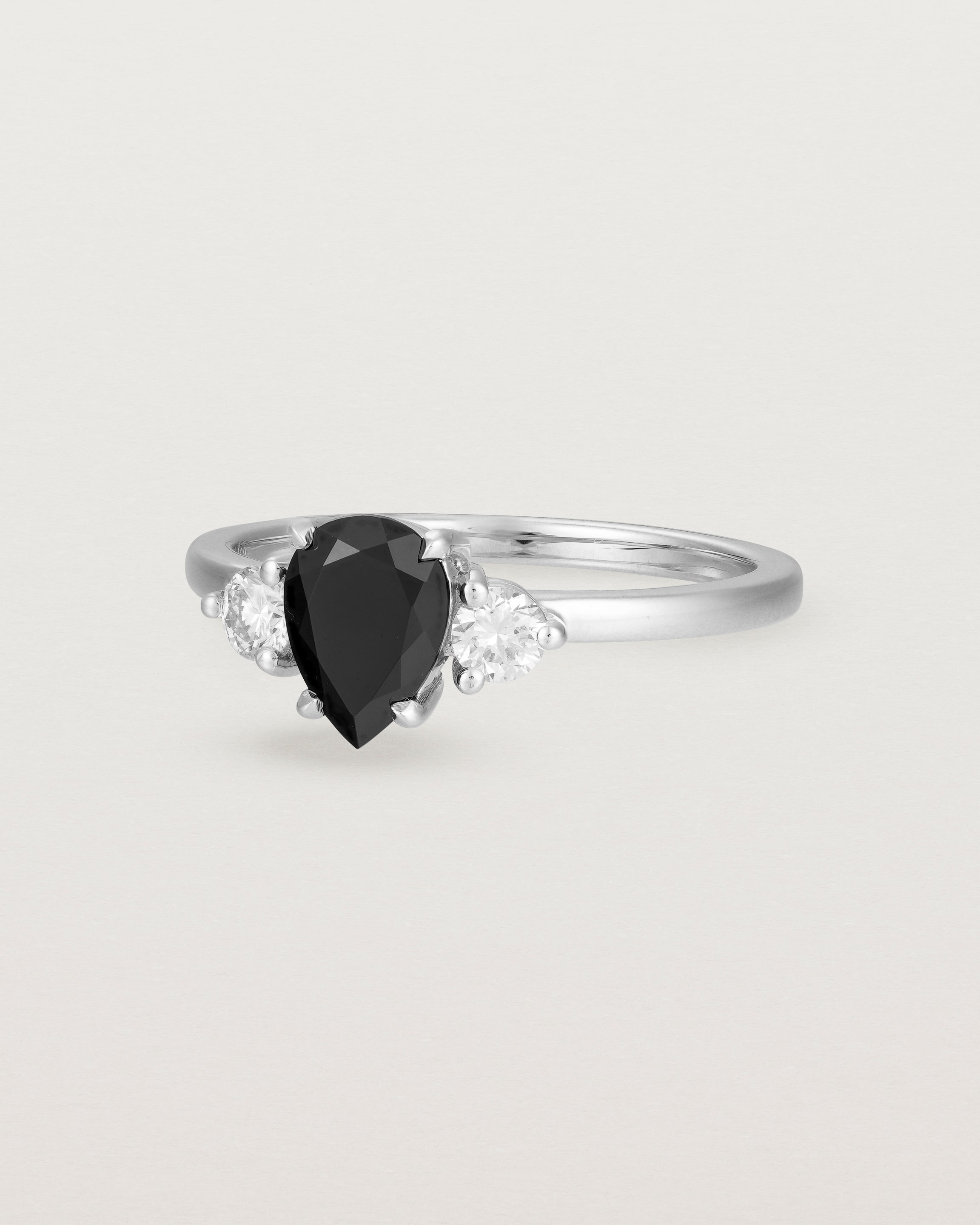 Angled view of the Una Pear Trio Ring | Black Spinel & Diamonds | White Gold.