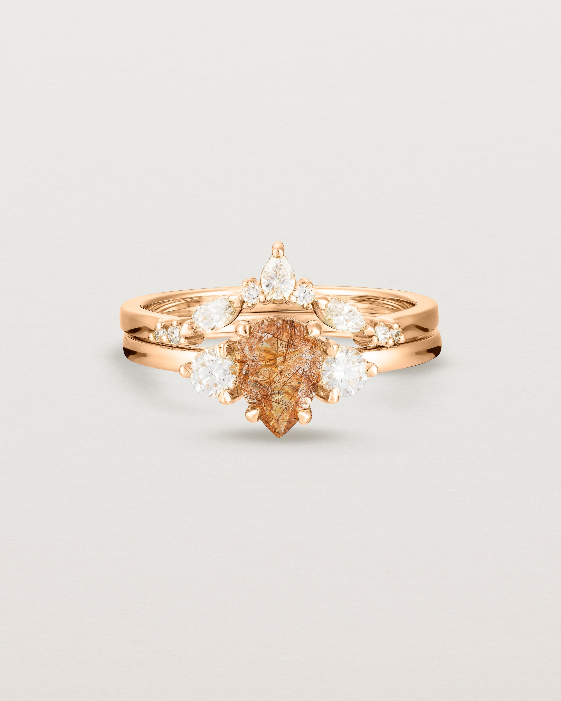 Front view of the Una Pear Trio Ring | Rutilated Quartz & Diamonds | Rose Gold stacked with the Meia Crown Ring.