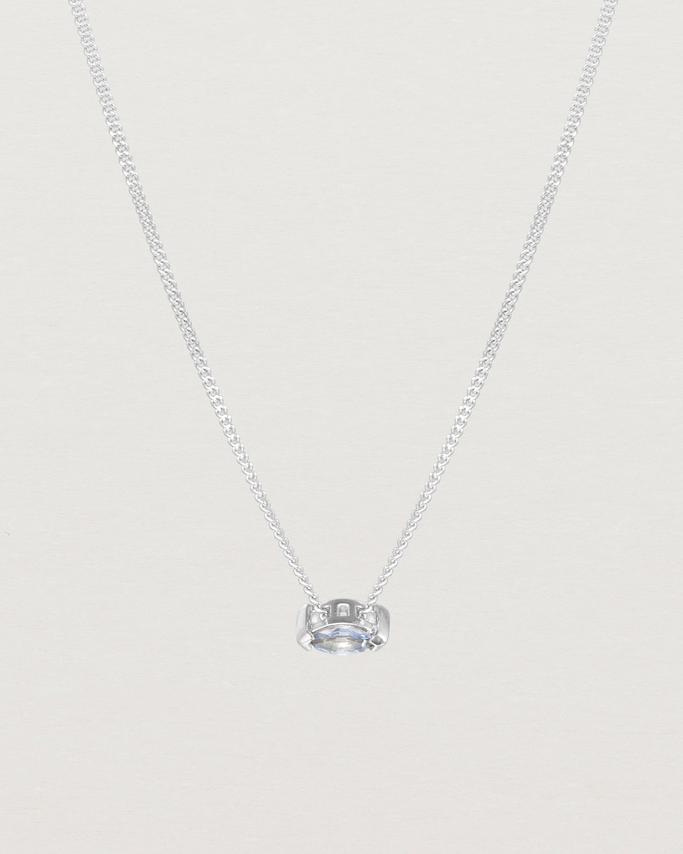 Close up view of the Vega Slider Necklace | Sapphire | White Gold.