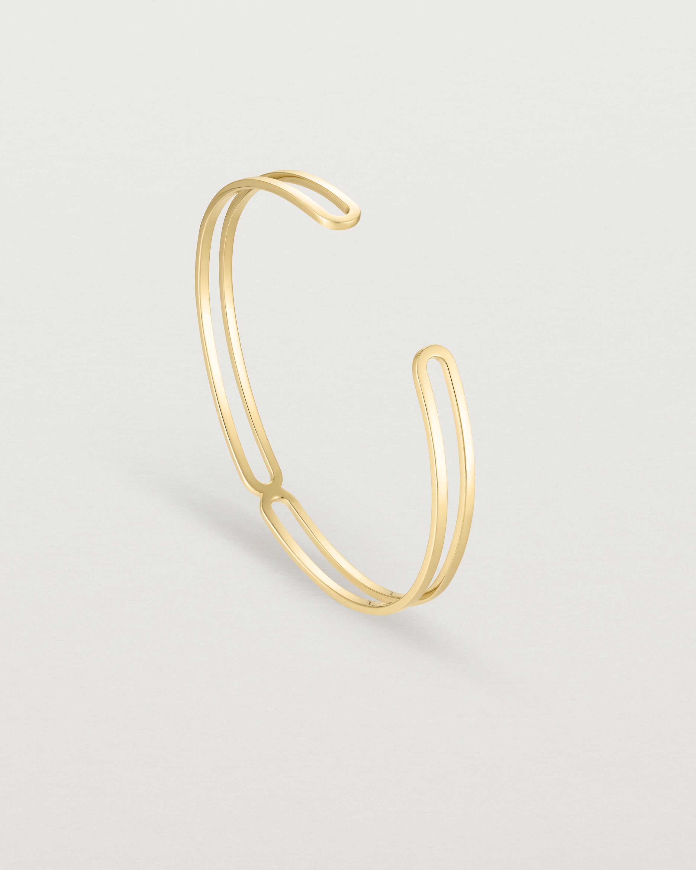 Standing view of the Ailing Cuff Bangle in Yellow Gold.