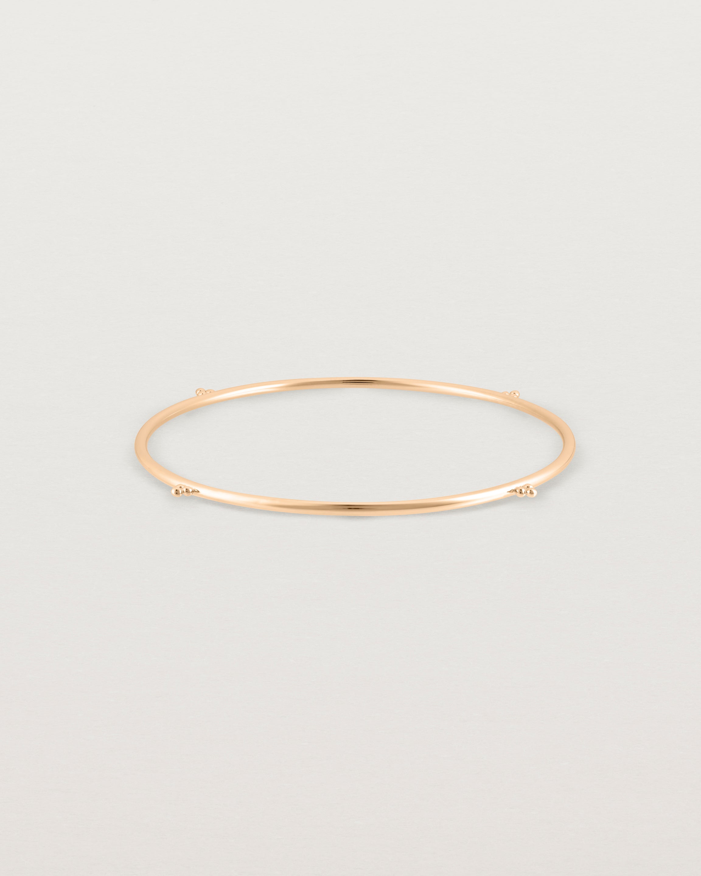 Front view of the Alya Bangle in Rose Gold.