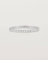 white gold band with half a band of micro pave diamonds