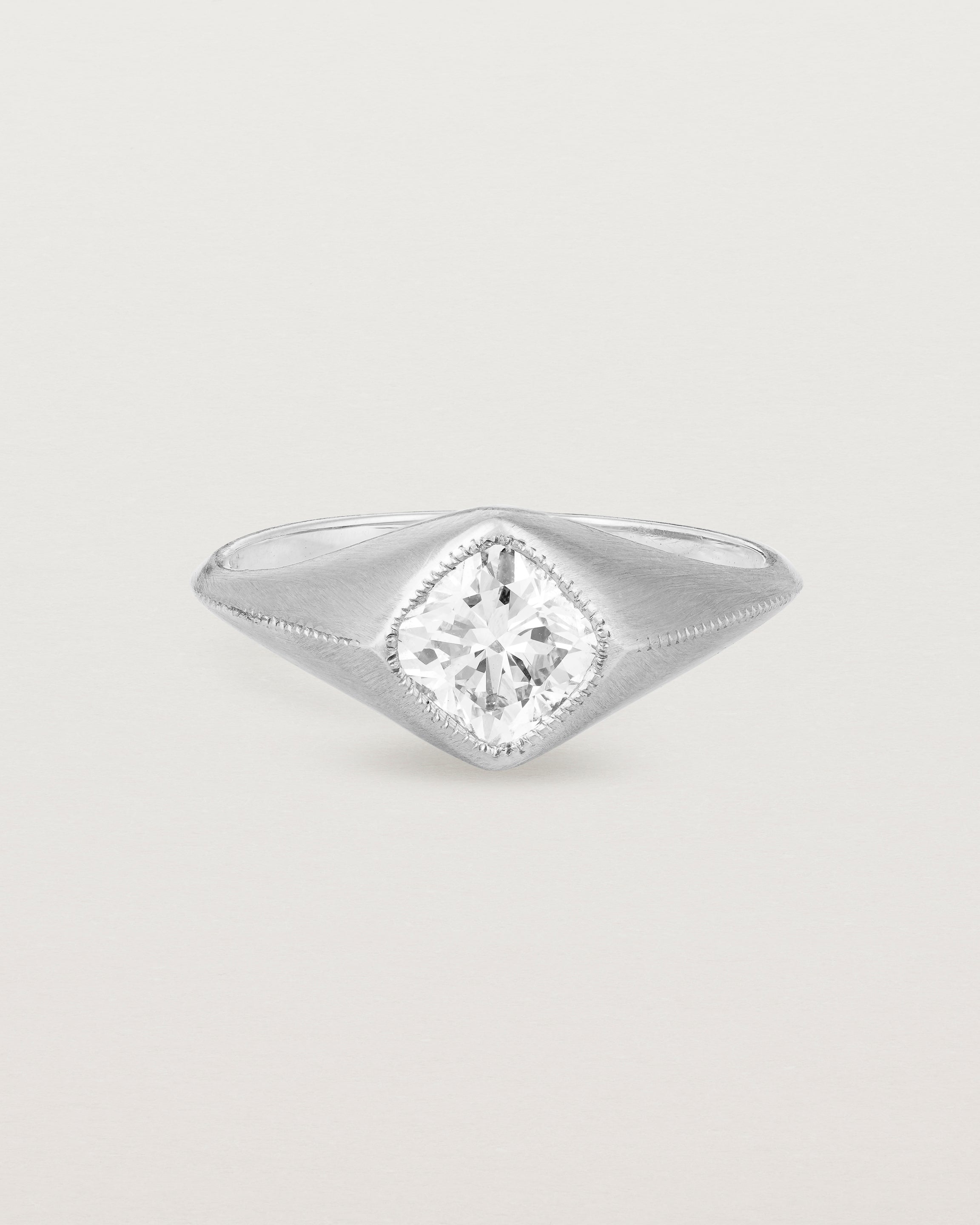 A white gold Signet Ring featuring a cushion cut white diamond. _label: Matte Finish Example