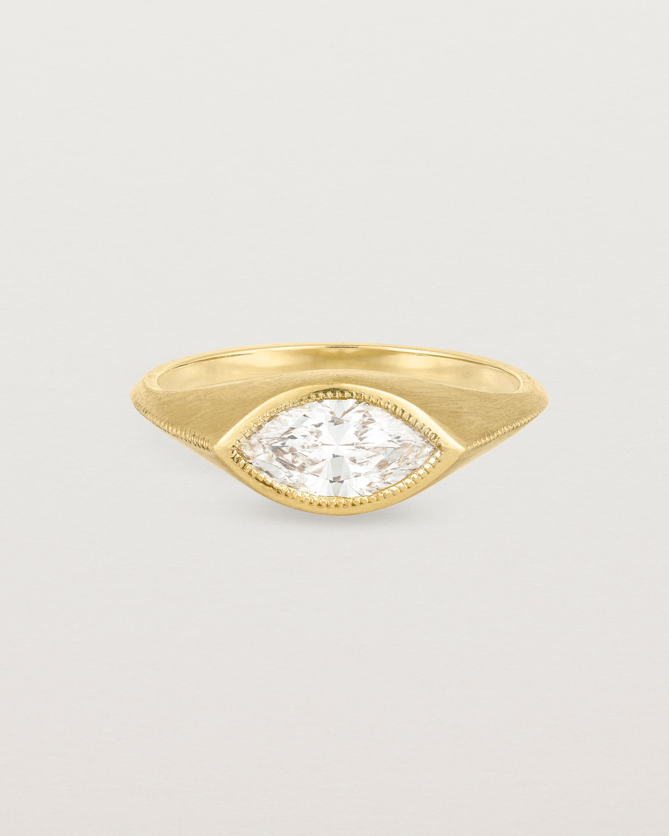 A yellow gold Signet Ring featuring a marquise cut white diamond. _label: Matte Finish Example