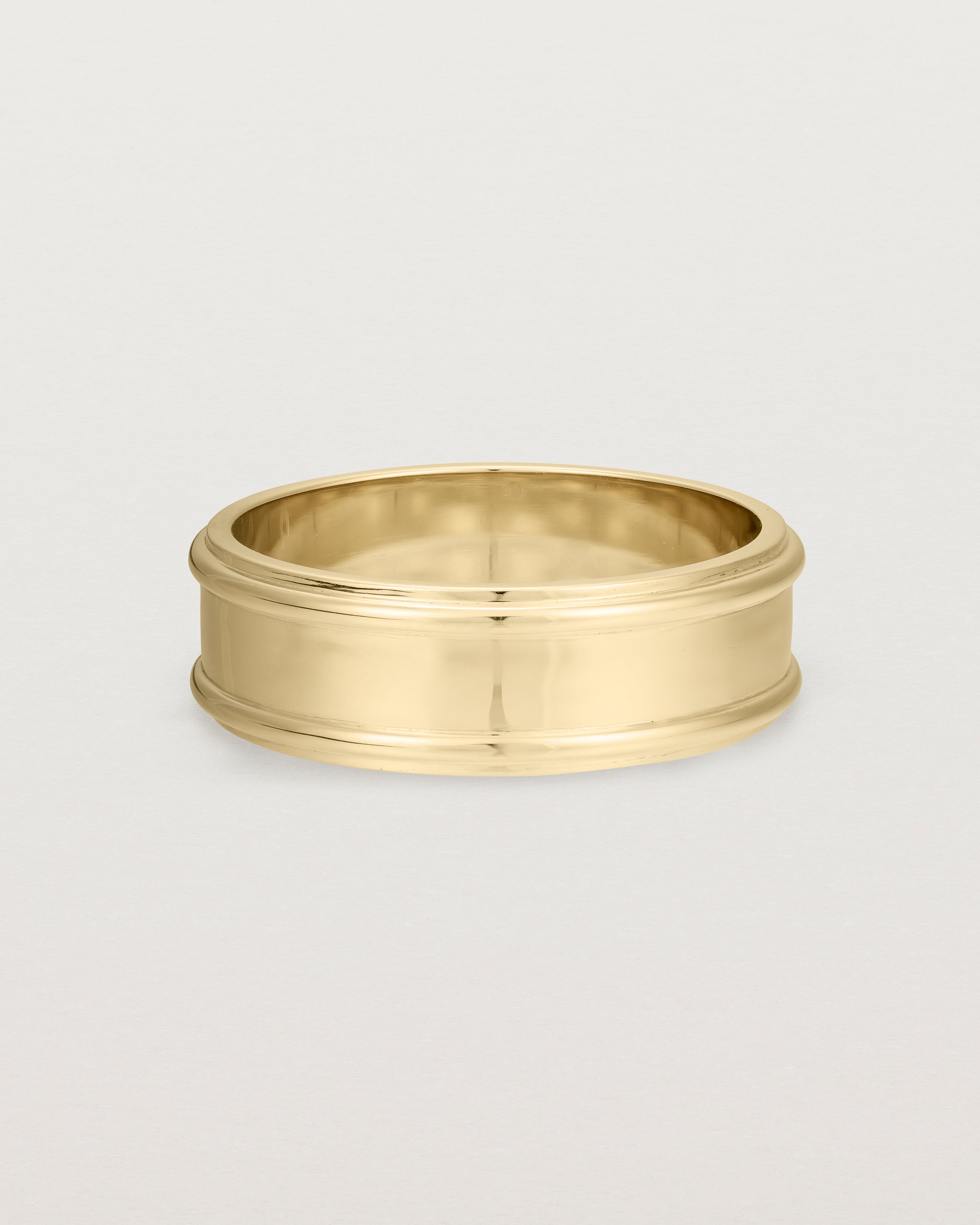 Front view of the Border Wedding Ring | 7mm | Yellow Gold.