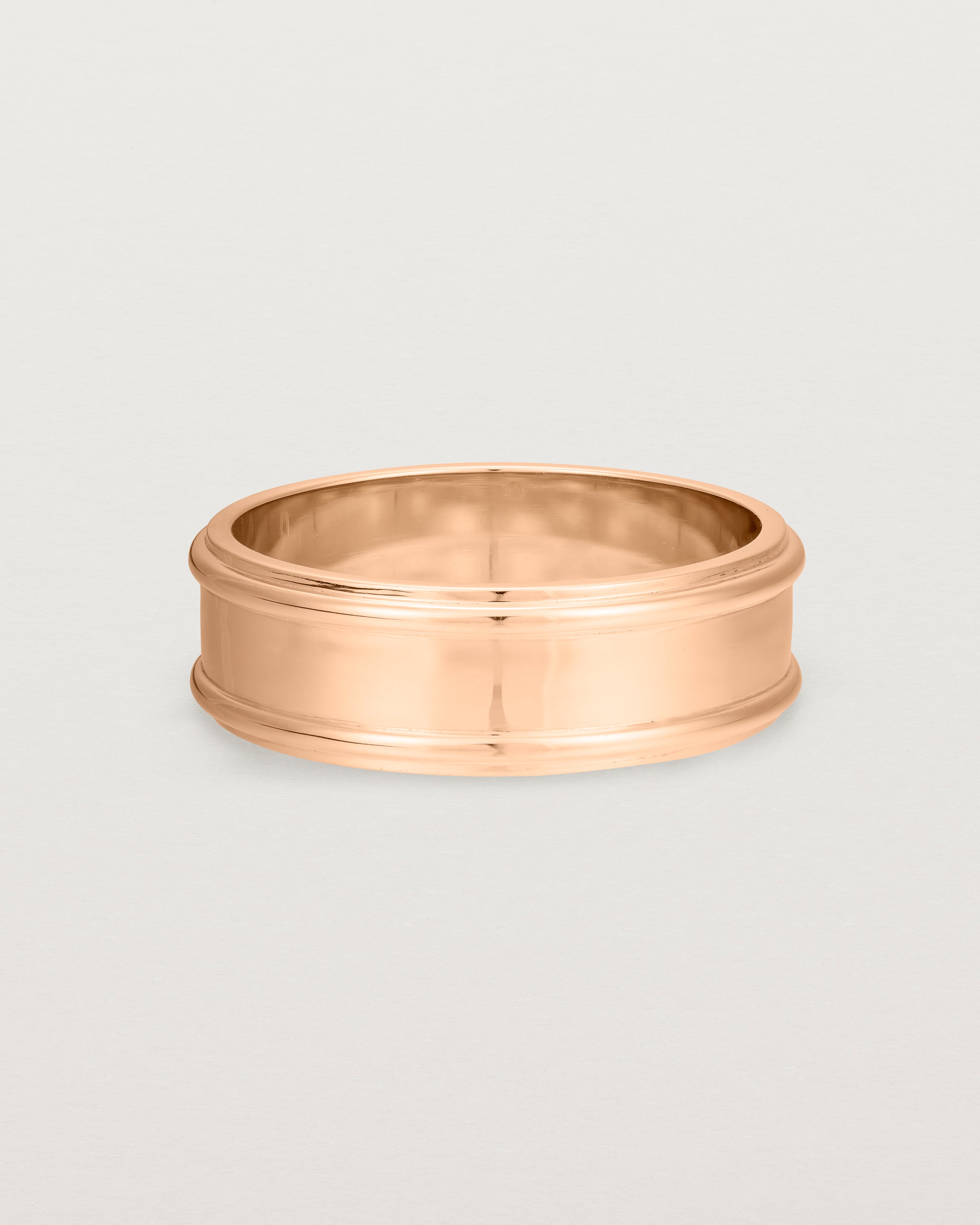 Front view of the Border Wedding Ring | 7mm | Rose Gold.