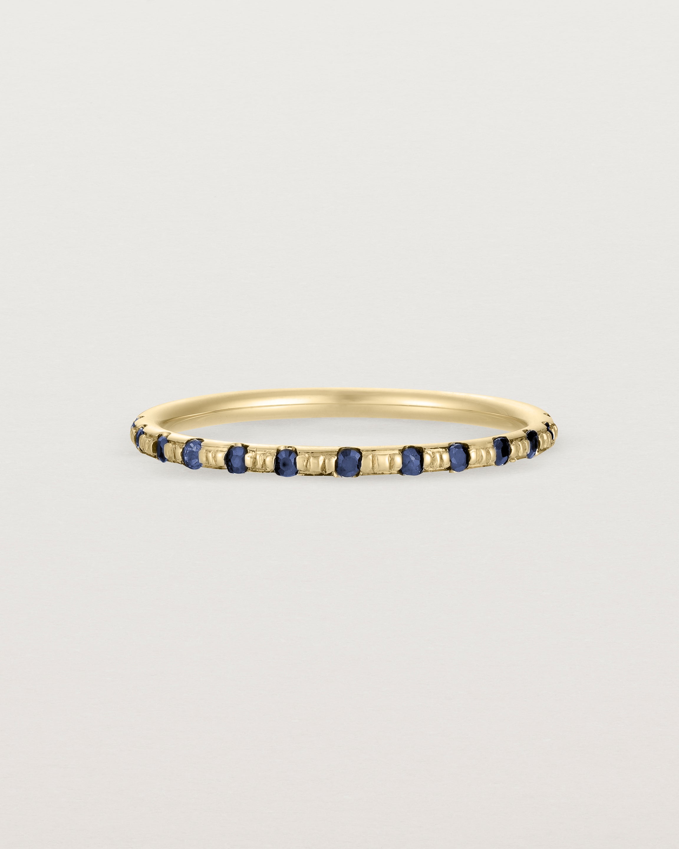 Front View of Cascade Round Profile Wedding Ring | Sapphire | Yellow Gold 