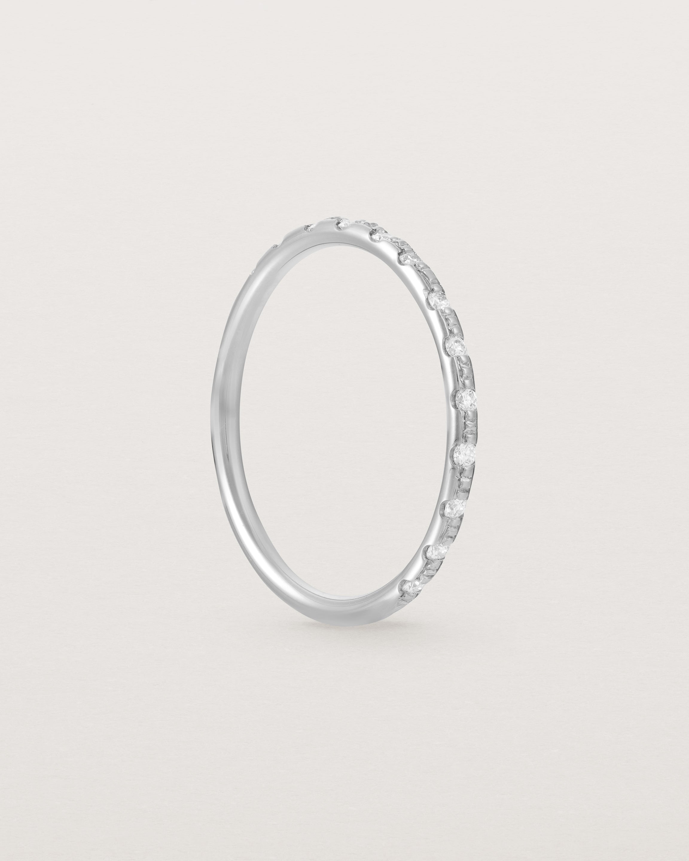 Angled View of Cascade Round Profile Wedding Ring | Diamonds | White Gold