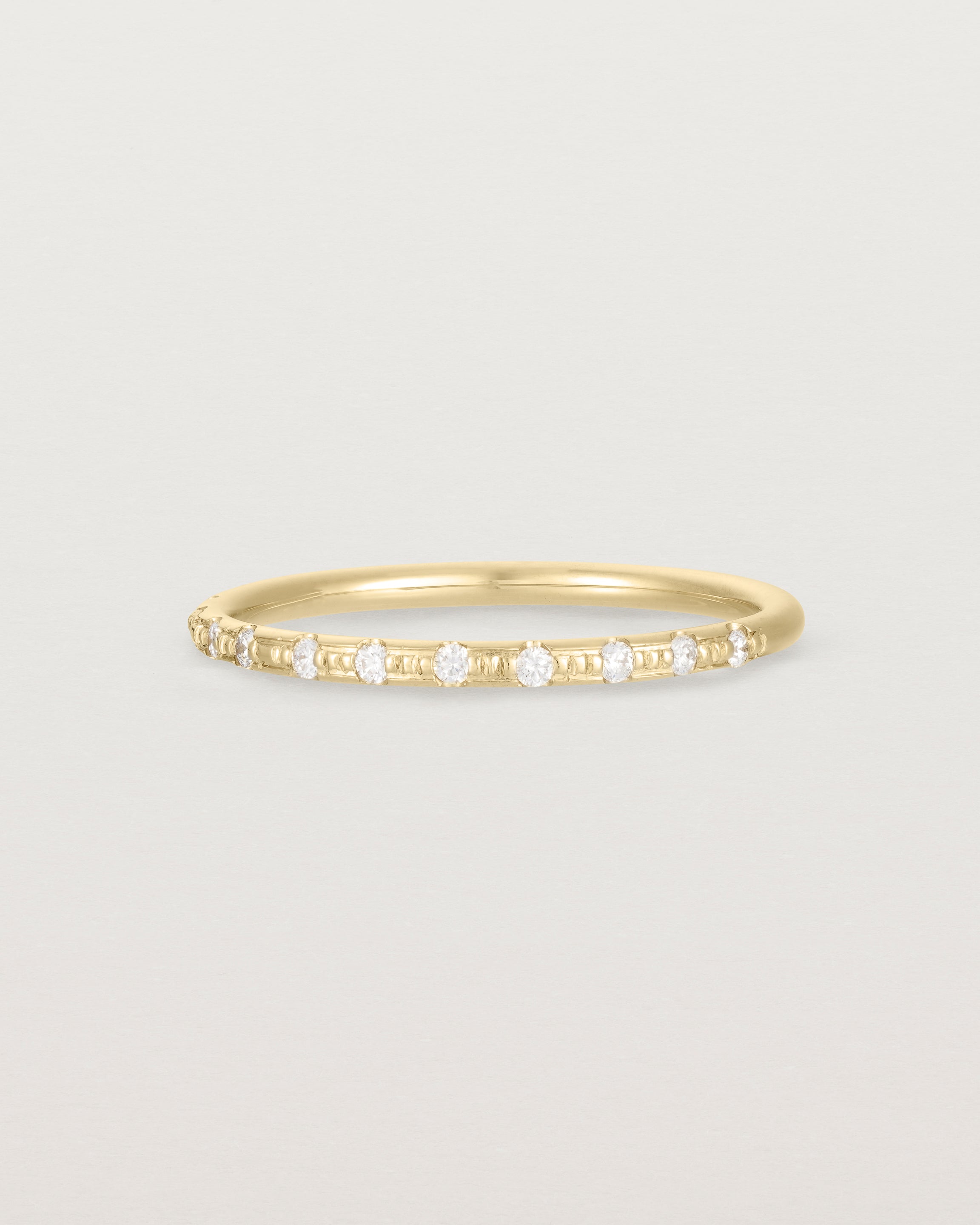 Angled View of Cascade Round Profile Wedding Ring | Diamonds | Yellow Gold