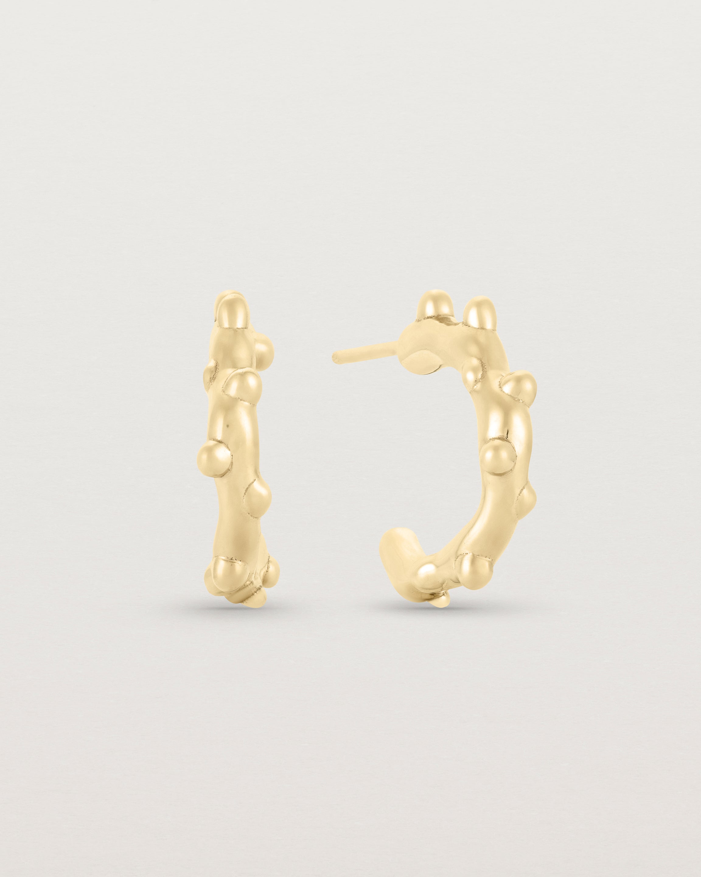 A pair of Dotted Organic Hoops | Yellow Gold.