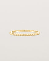 Front view of the Dotted Stacking Ring in Yellow Gold.