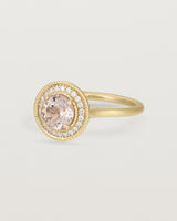Angled view of the Imogen Halo Ring | Morganite & Diamonds in Yellow Gold.