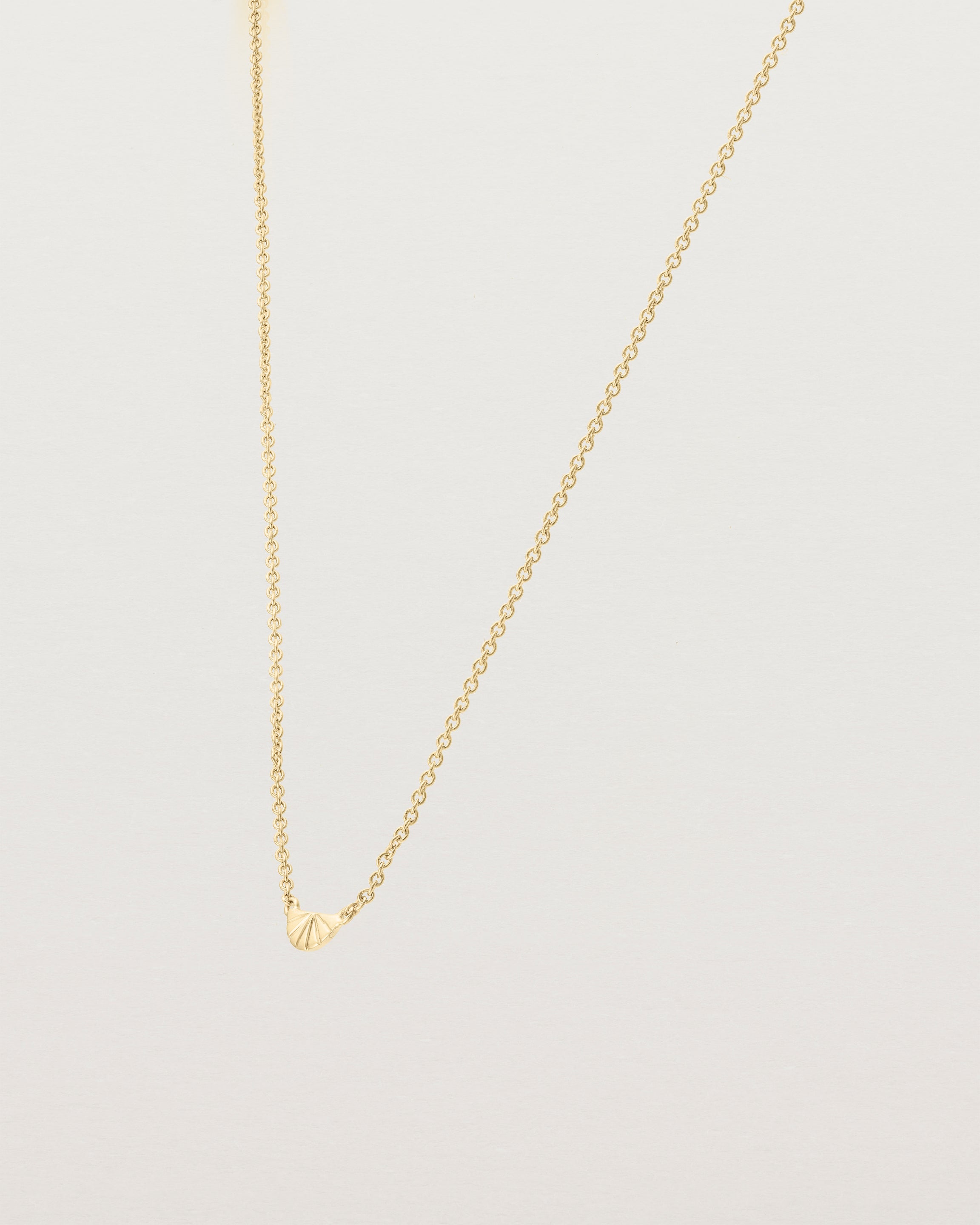 Angled view of the Jia Necklace in Yellow Gold.