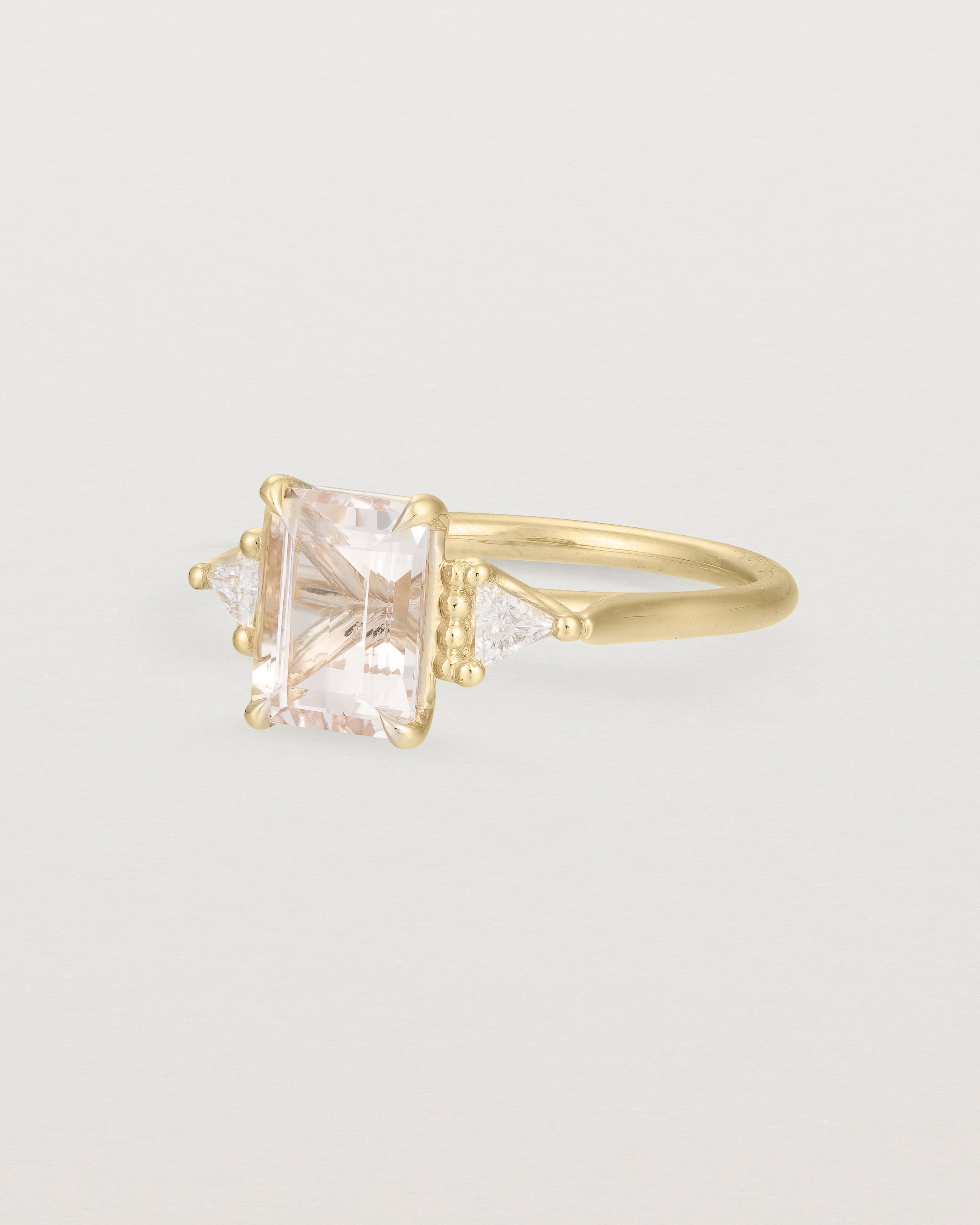 Angled view of the Lille Ring | Morganite & Diamonds in Yellow Gold.