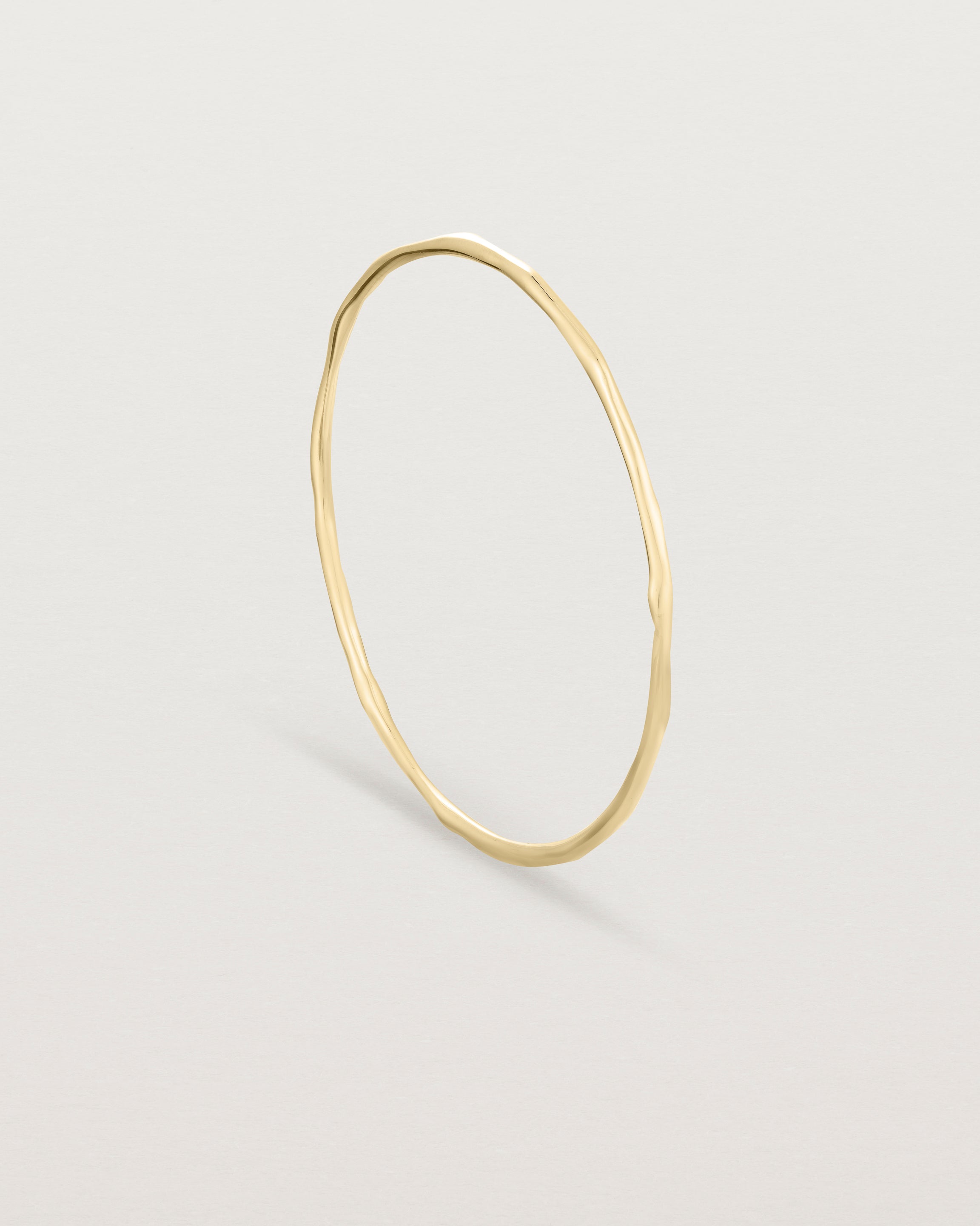 Standing view of the Organic Bangle | Yellow Gold.
