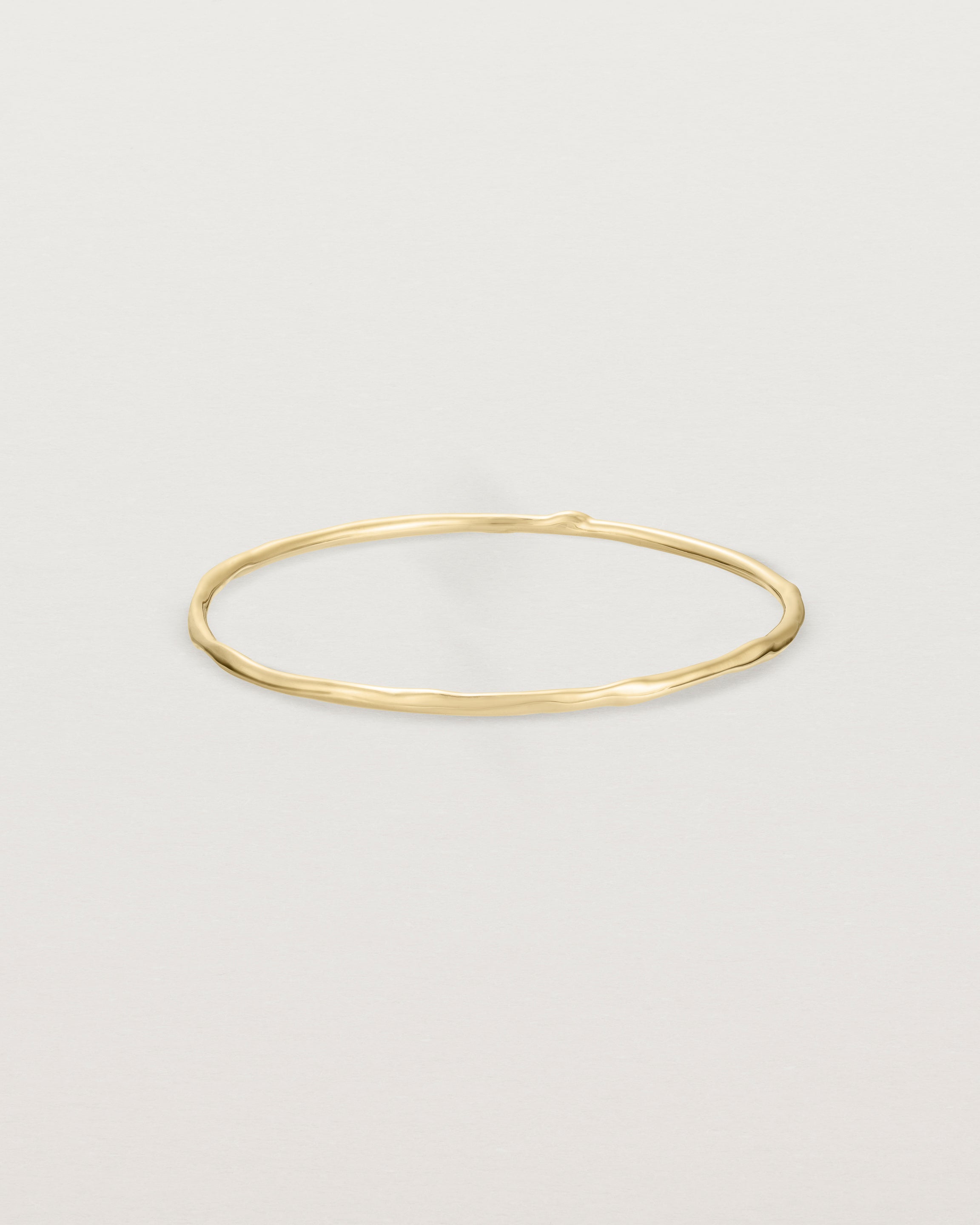Front view of the Organic Bangle | Yellow Gold.