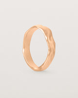 The Organic Wedding Ring | 4mm | Rose Gold standing. 
