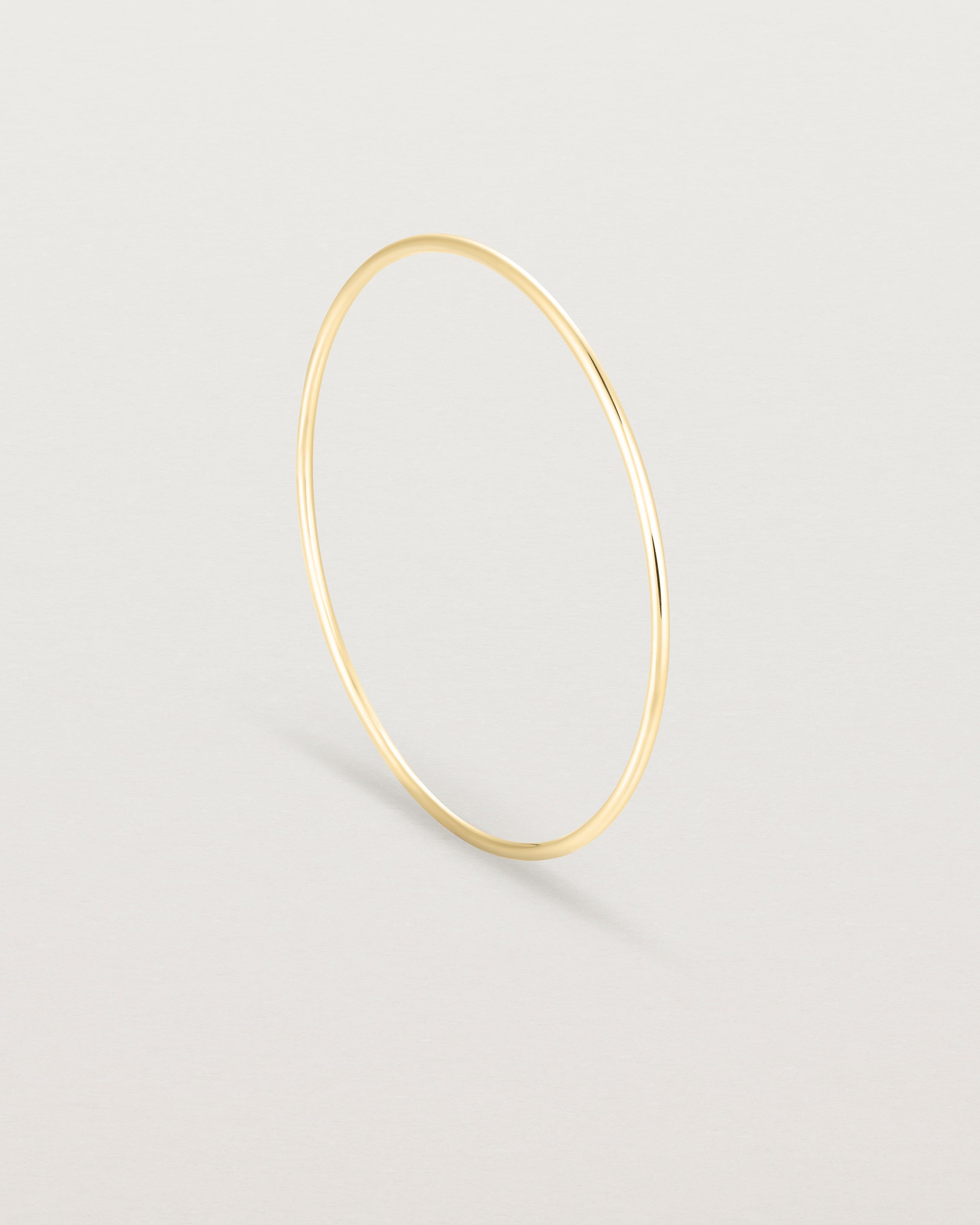 Standing view of the Oval Bangle in Yellow Gold.