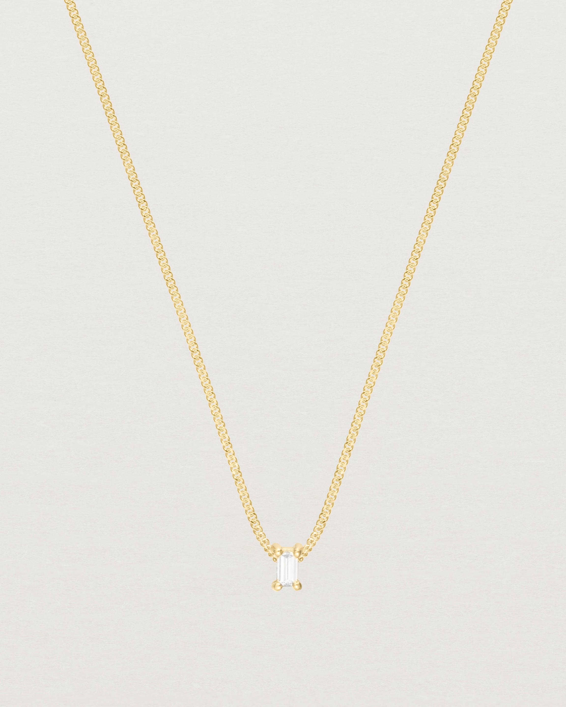 Close up of the Sena Slider Necklace with White Diamond in yellow gold.