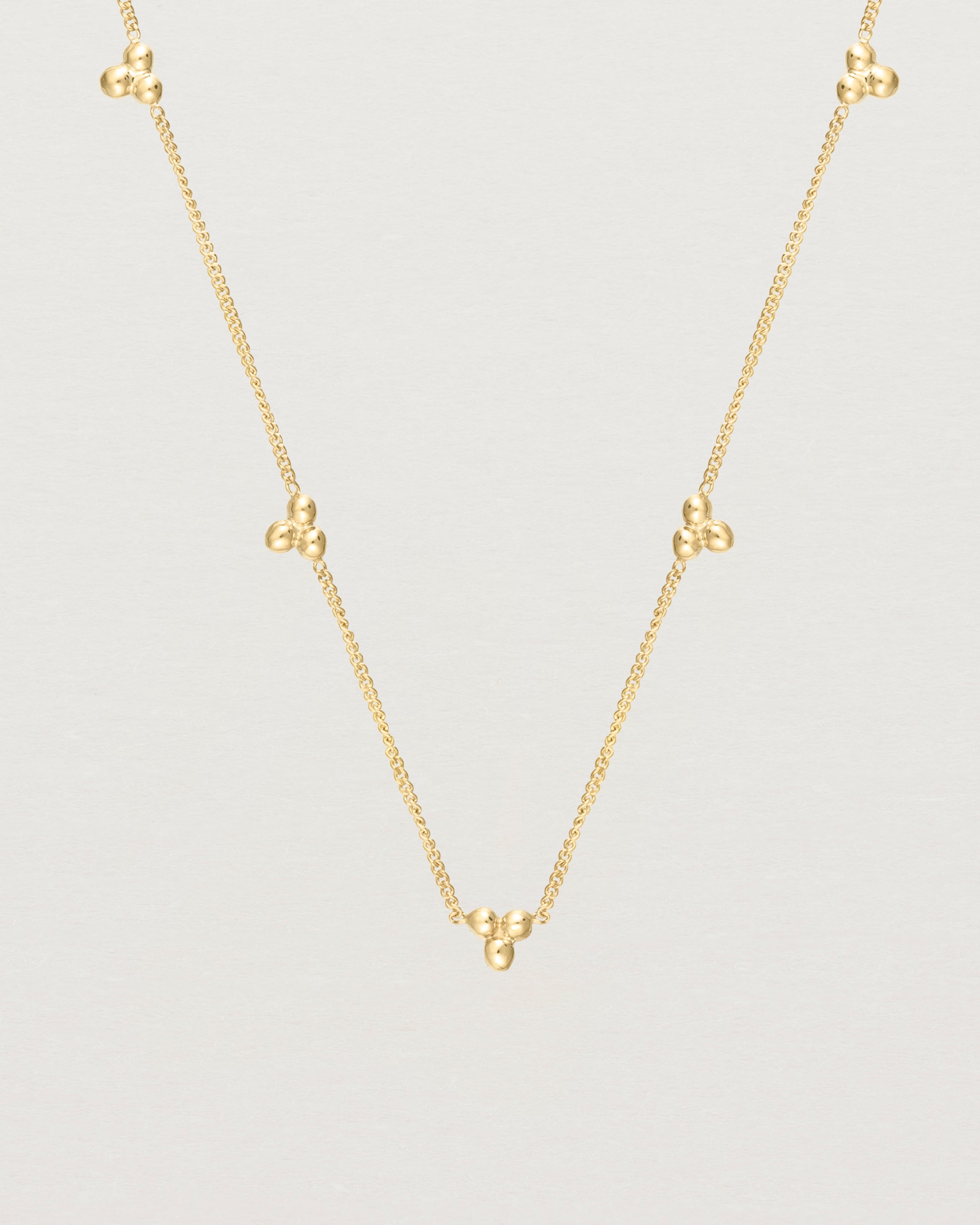Close up of the Tellue Necklace in yellow gold.