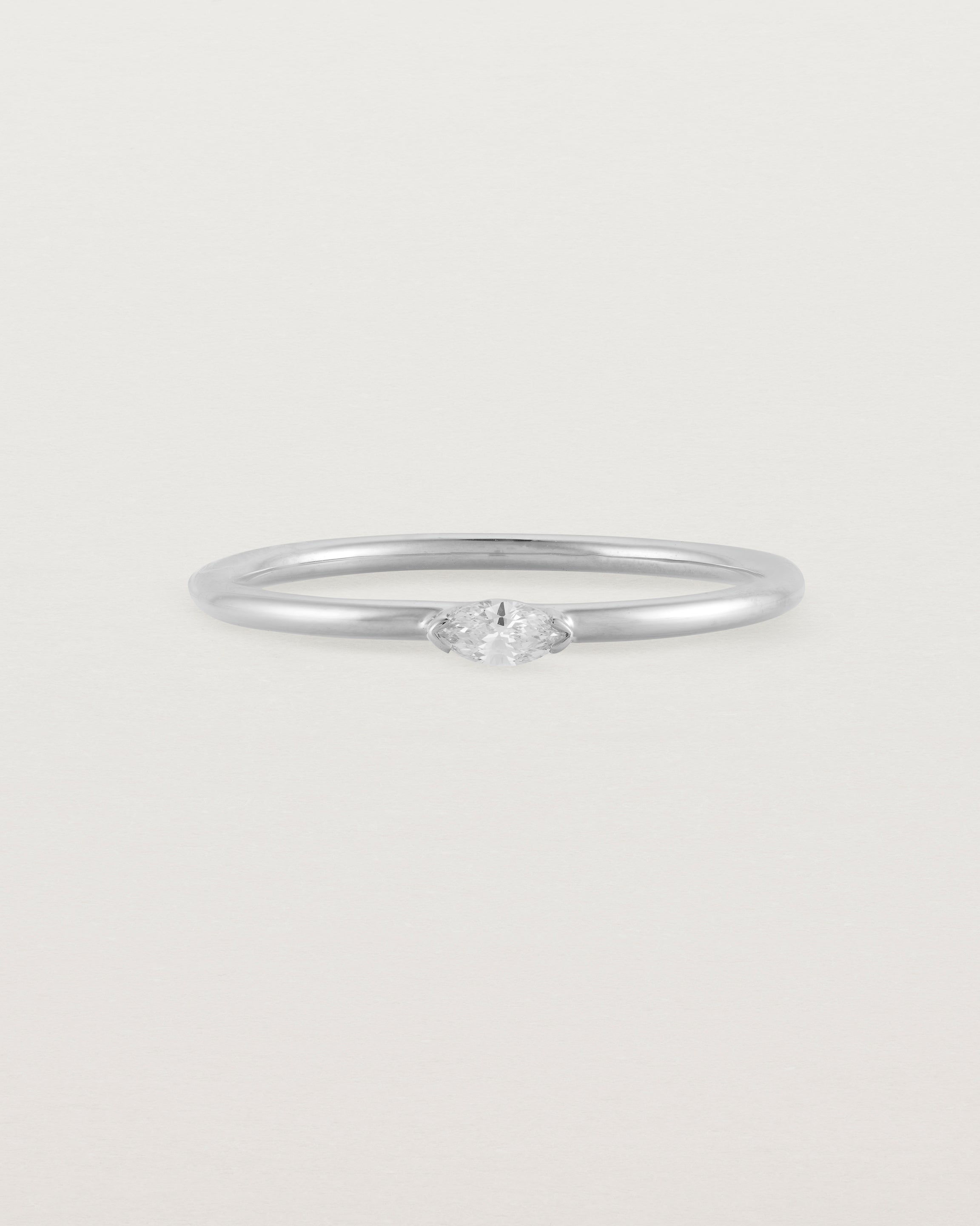 Fine white gold stacking ring featuring a white marquise centre diamond
