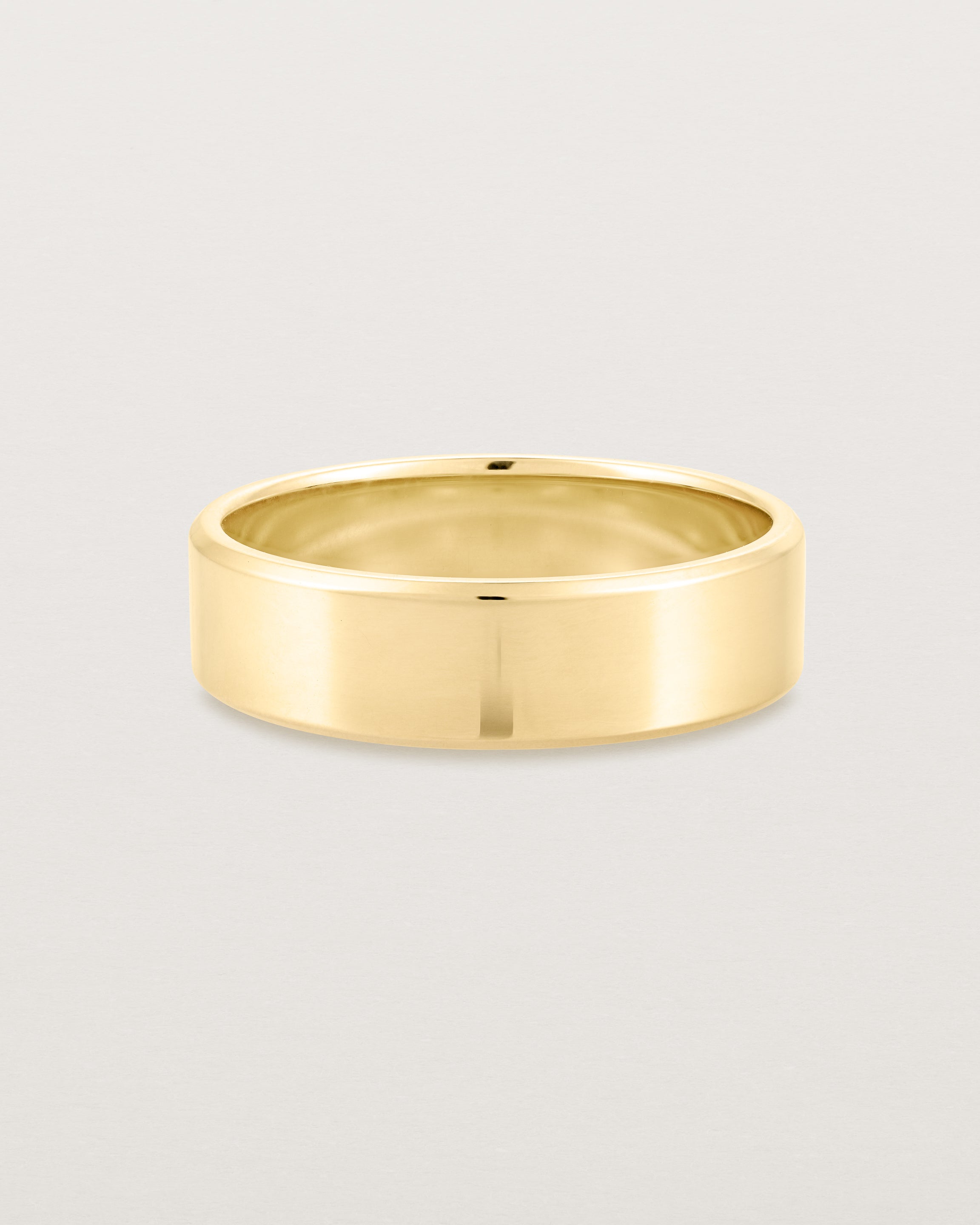 Front view of the Chamfered Wedding Ring | 6mm in Yellow Gold.