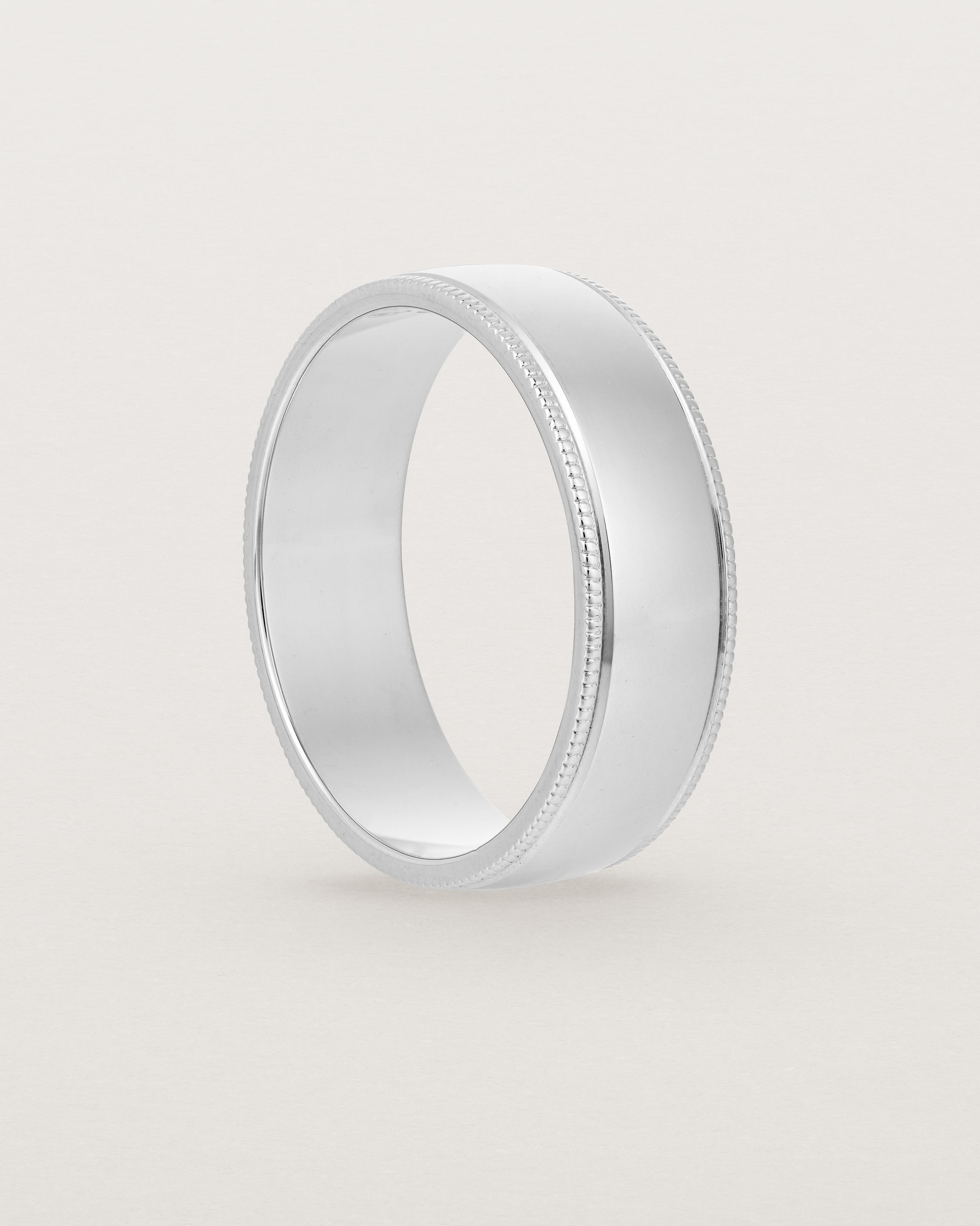 Standing view of the Millgrain Wedding Ring | 6mm in White Gold.