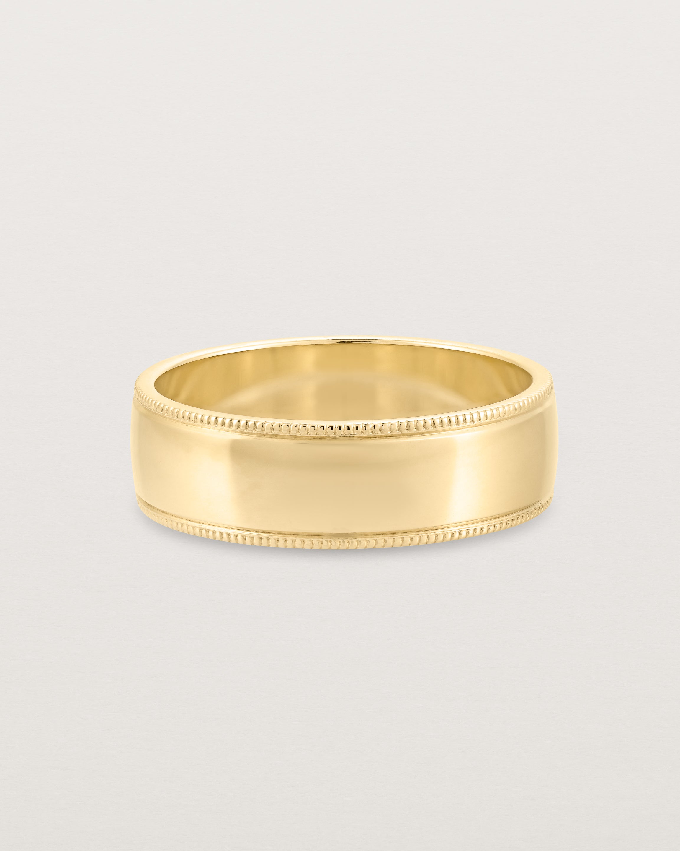Front view of the Millgrain Wedding Ring | 6mm in Yellow Gold.
