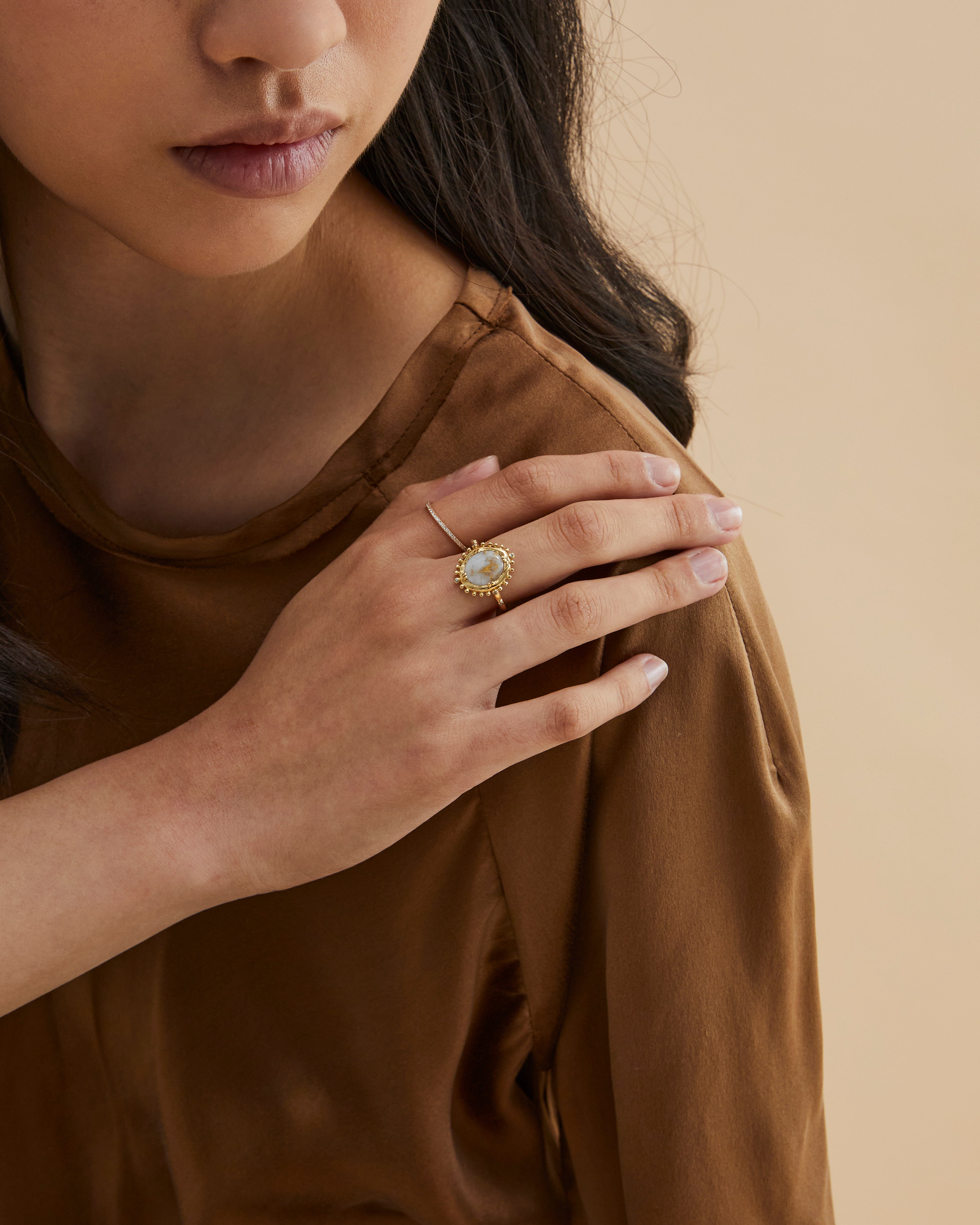 Model wears our Without a Compass ring in yellow gold