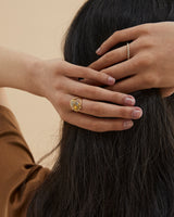 Model wears our Through Umber ring in yellow