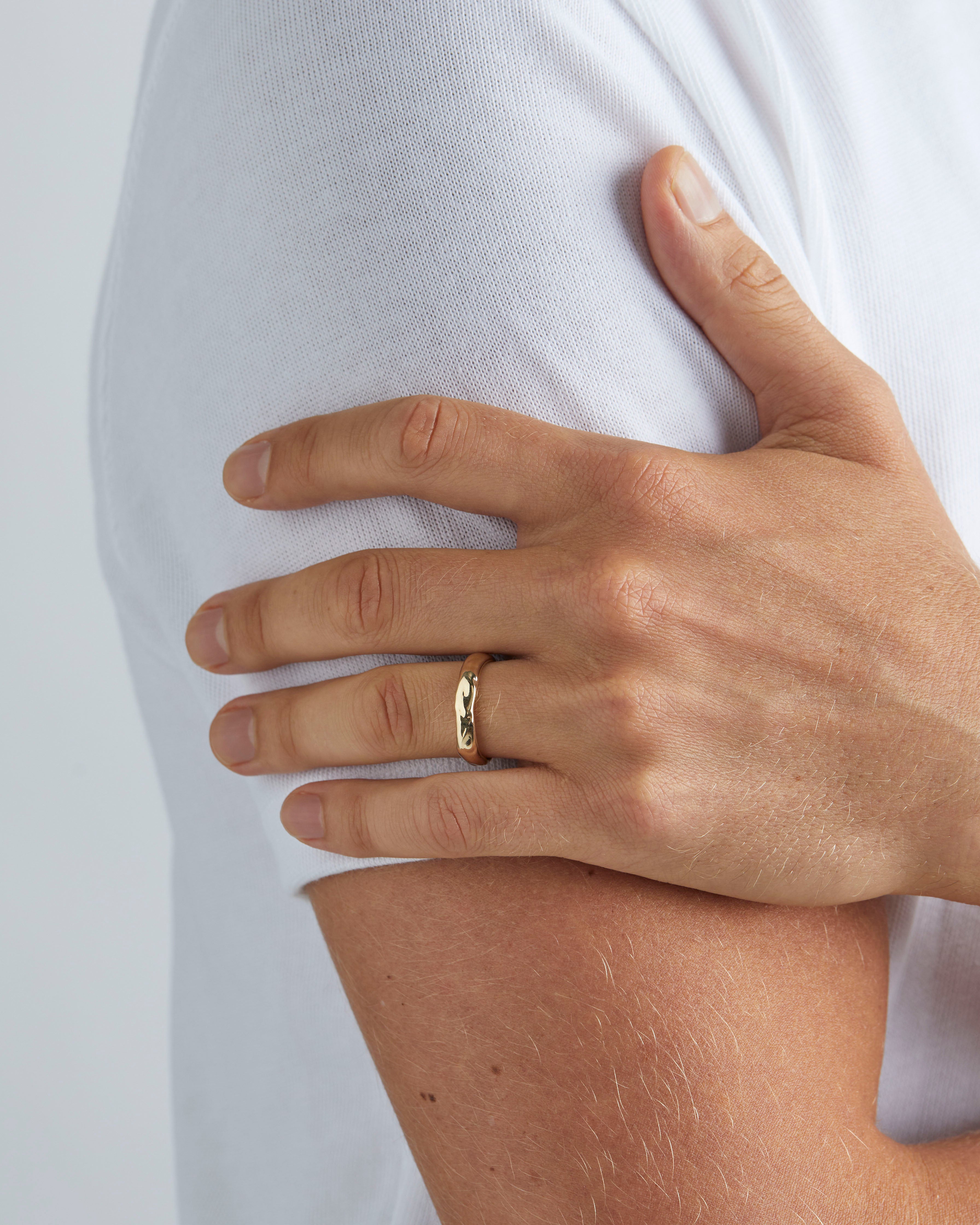 Male wearing the Organic Wedding Ring | 4mm in Yellow Gold. 