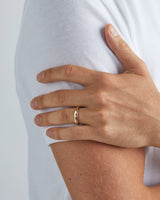 Male wearing the Organic Wedding Ring | 4mm in Yellow Gold