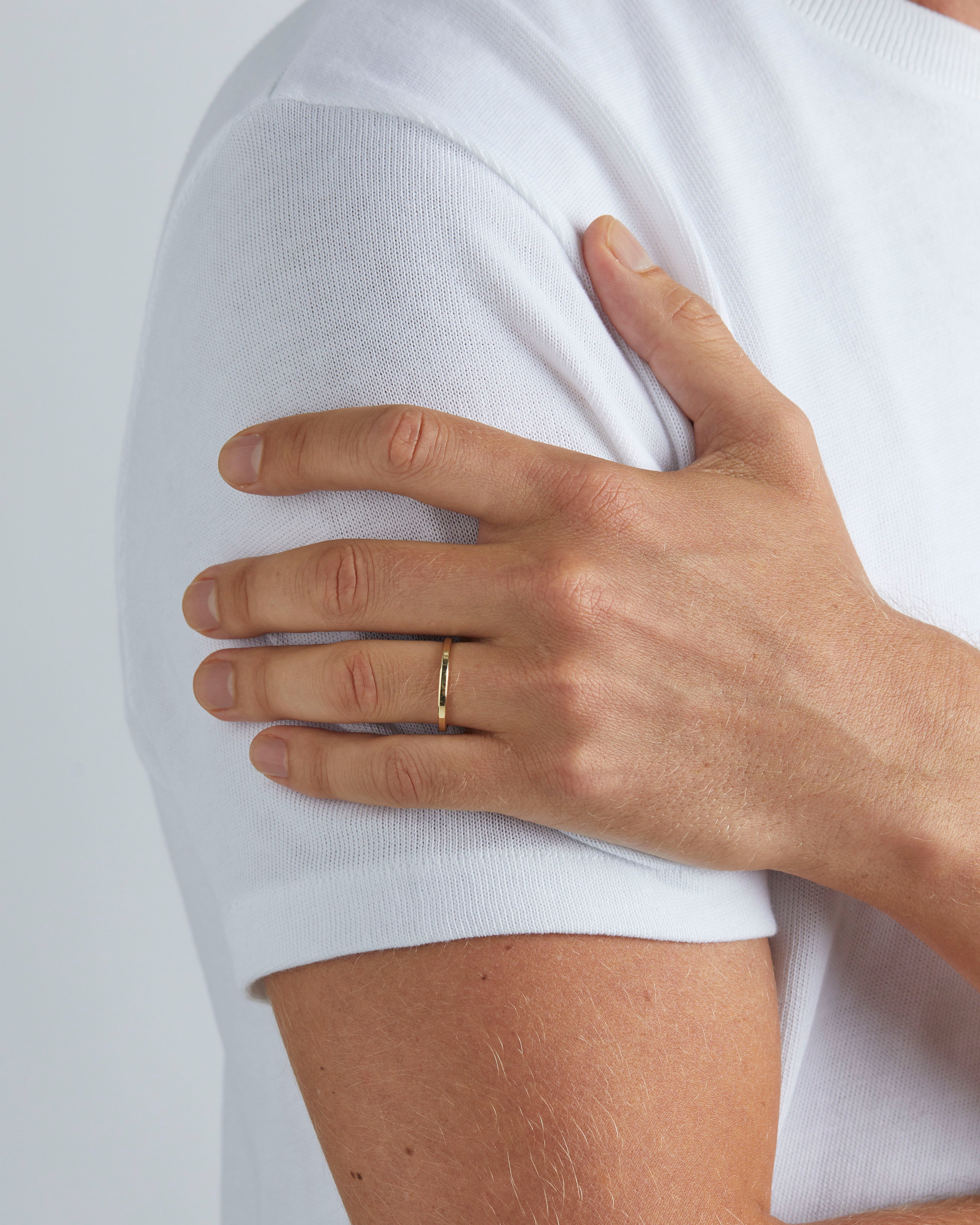 Model wearing 2mm Rose Gold Wedding Band with a Chamfered Edge 