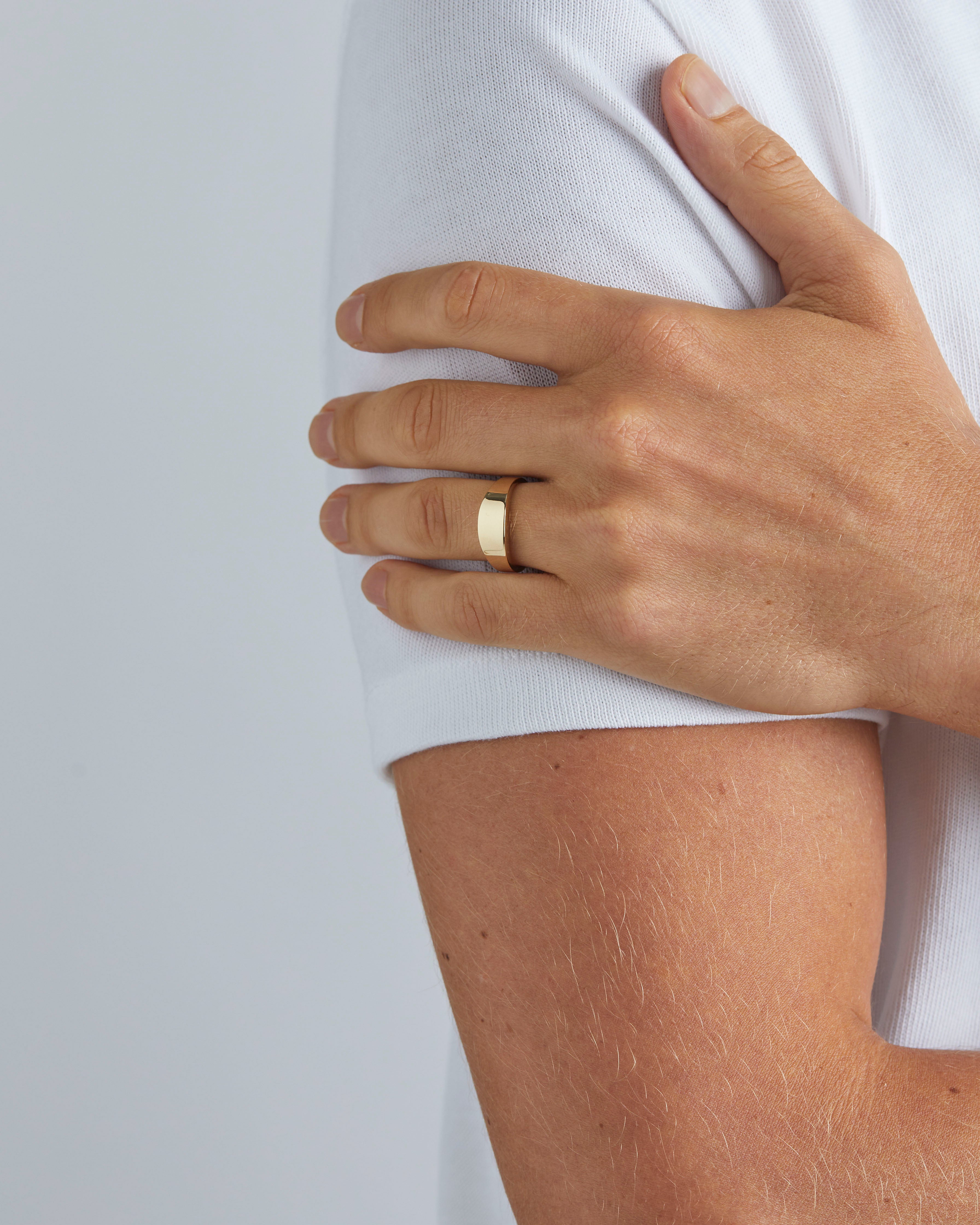Male wearing the Amos Signet in Yellow Gold. 