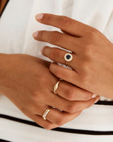A model wears a classic Australian blue sapphire halo engagement ring